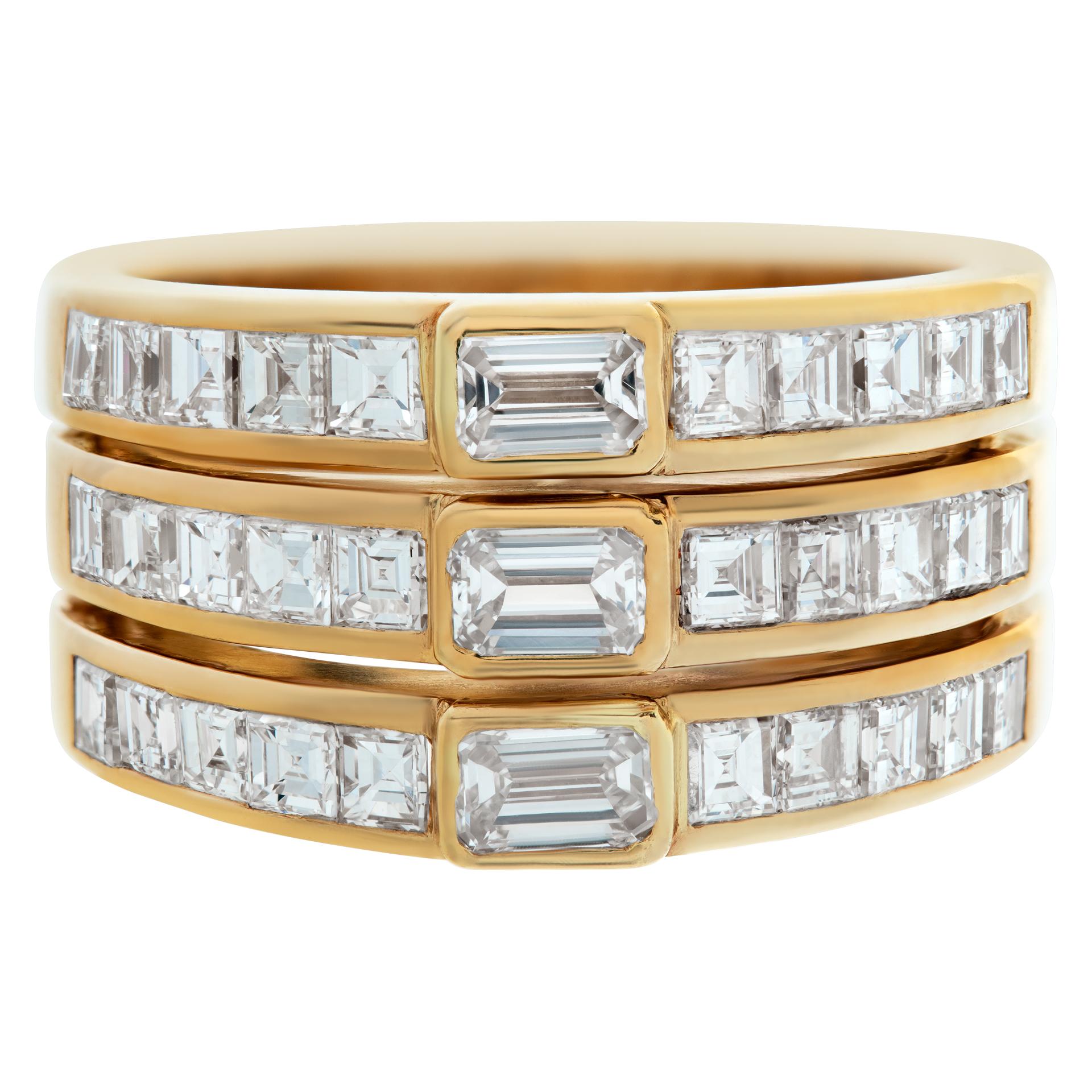 Three stacked diamond rings in 18k yellow gold with approximately 0.50 carats in center emerald cut diamonds (H-I color, VS clarity) and 2.25 carats in asscher cut diamonds (G-H color, VS clarity). Ring size 5.75This Diamond ring is currently size