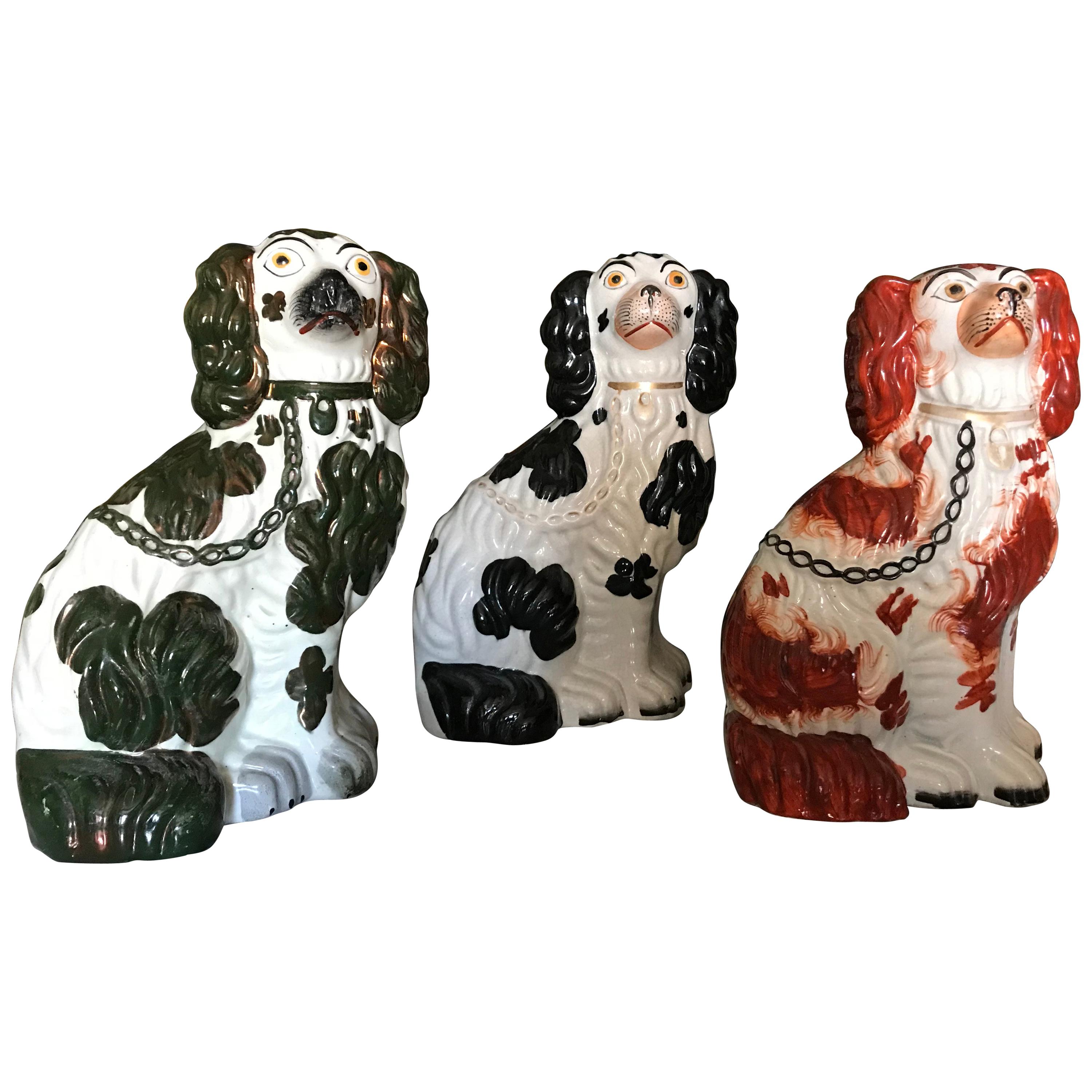 Three Staffordshire Dogs, with Different Color Spots & Gilded details, 19th C. For Sale