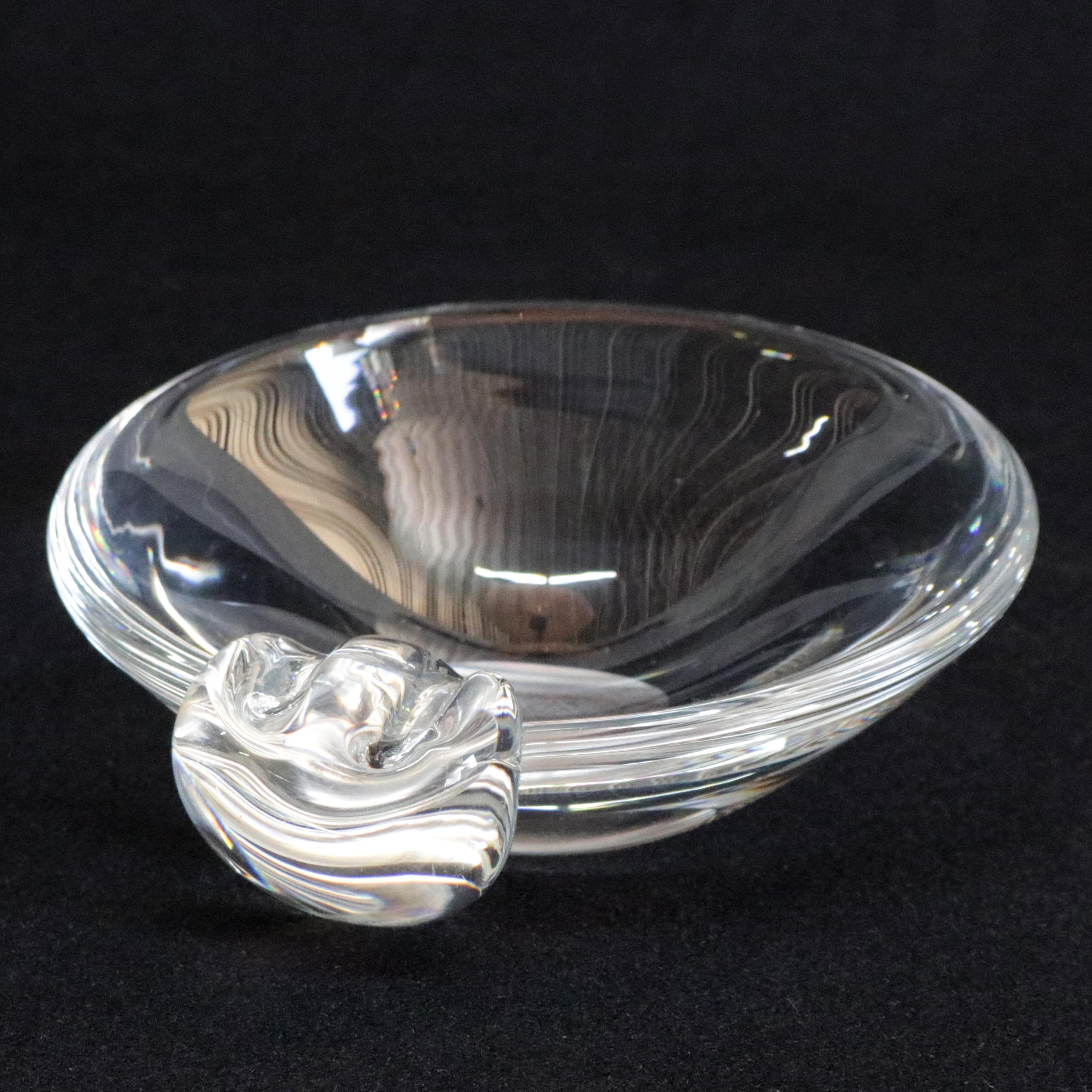 A set of three midcentury Steuben mouth blown crystal ashtrays feature colorless art glass in sloping bowl form designed in the 1940s and 1950s for corning museum of glass, New York, NY, signed on bases, 20th century.

Measure: 1.5