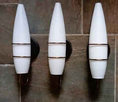 Three Stilnovo Style Brass Satin Glass Wall Sconces, Italy, 1950s