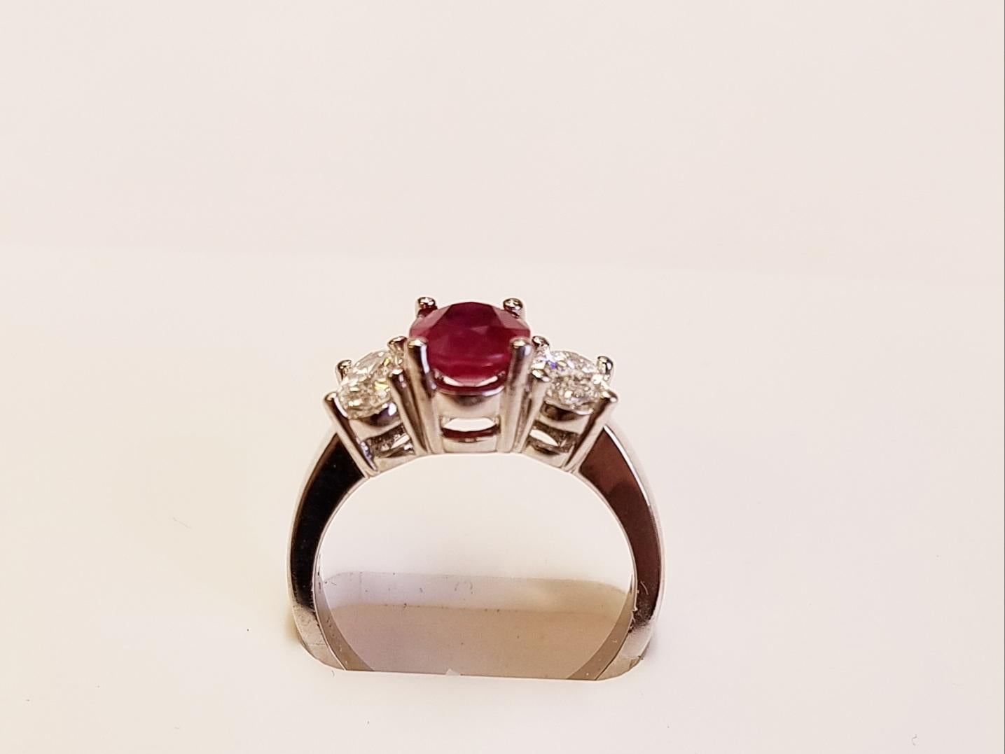 Contemporary Three-Stone 18 Karat White Gold Oval Cut Ruby and Diamond Ring