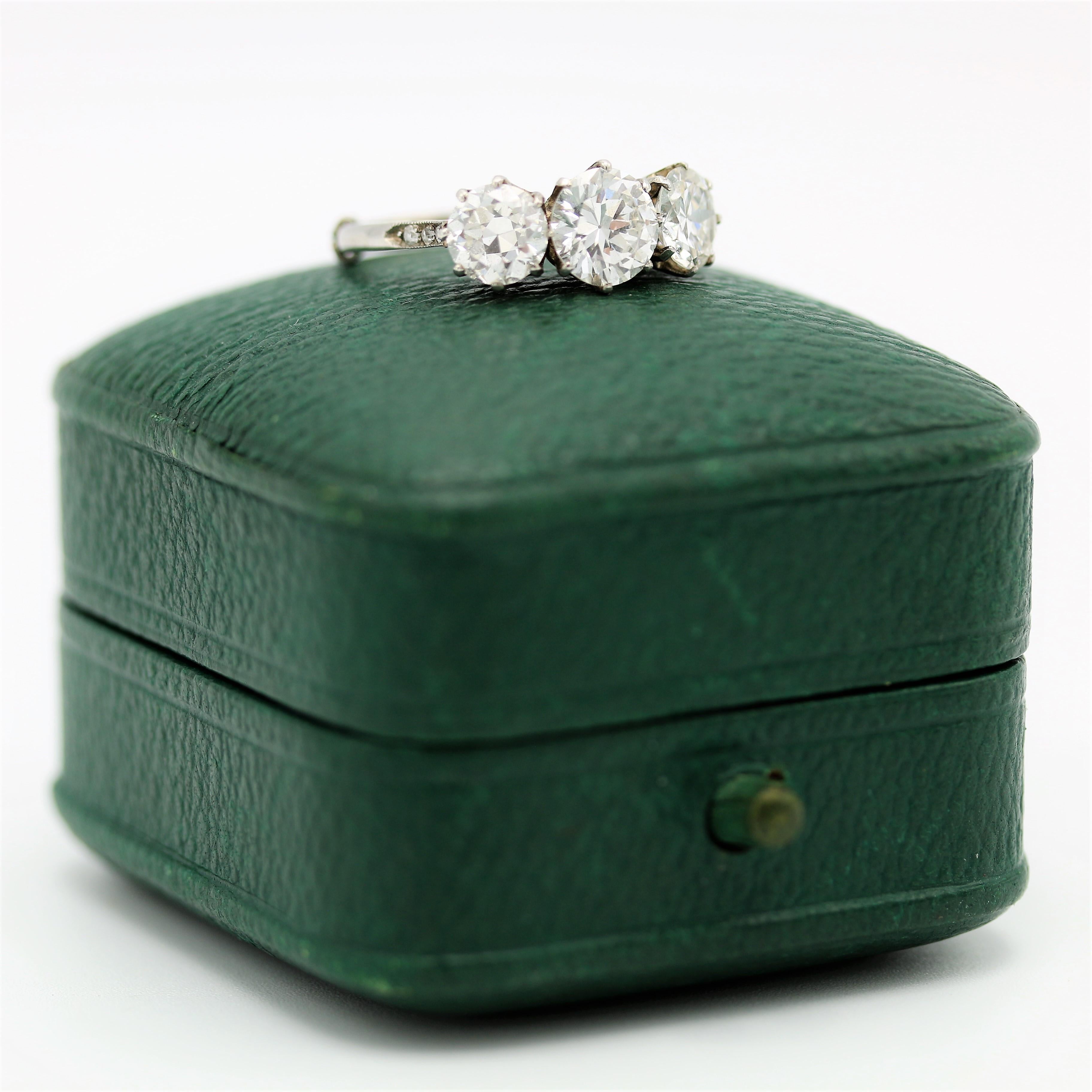 Brilliant Cut Three stone 2.6 carat transitional cut diamond engagement ring, circa 1940 For Sale