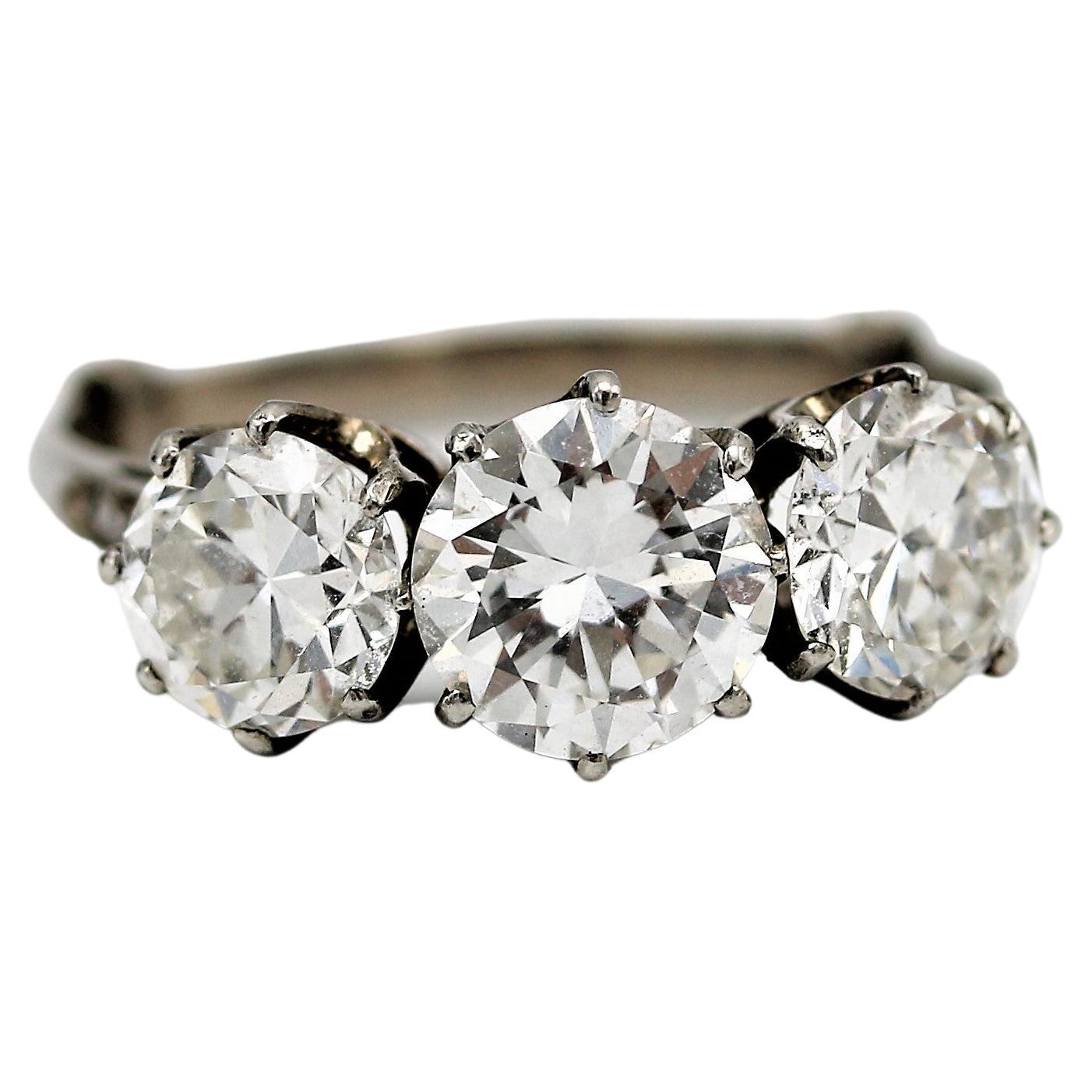 Three stone 2.6 carat transitional cut diamond engagement ring, circa 1940 For Sale