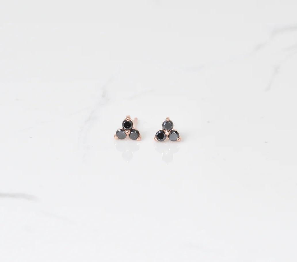 Pretty and petite! These beautiful black diamond studs make for perfect pair of earrings. Set in 14k rose gold. The dimensions of these earrings are 4.6mm x 5.2mm.