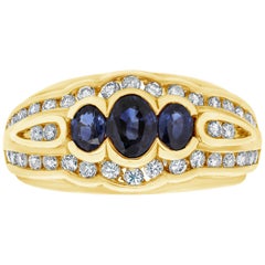 Modering mit drei Steinen, blauem Saphir und Diamant