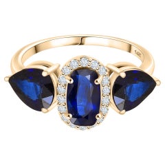 Bague de fiançailles à trois pierres saphir bleu avec diamants en or jaune 14 carats