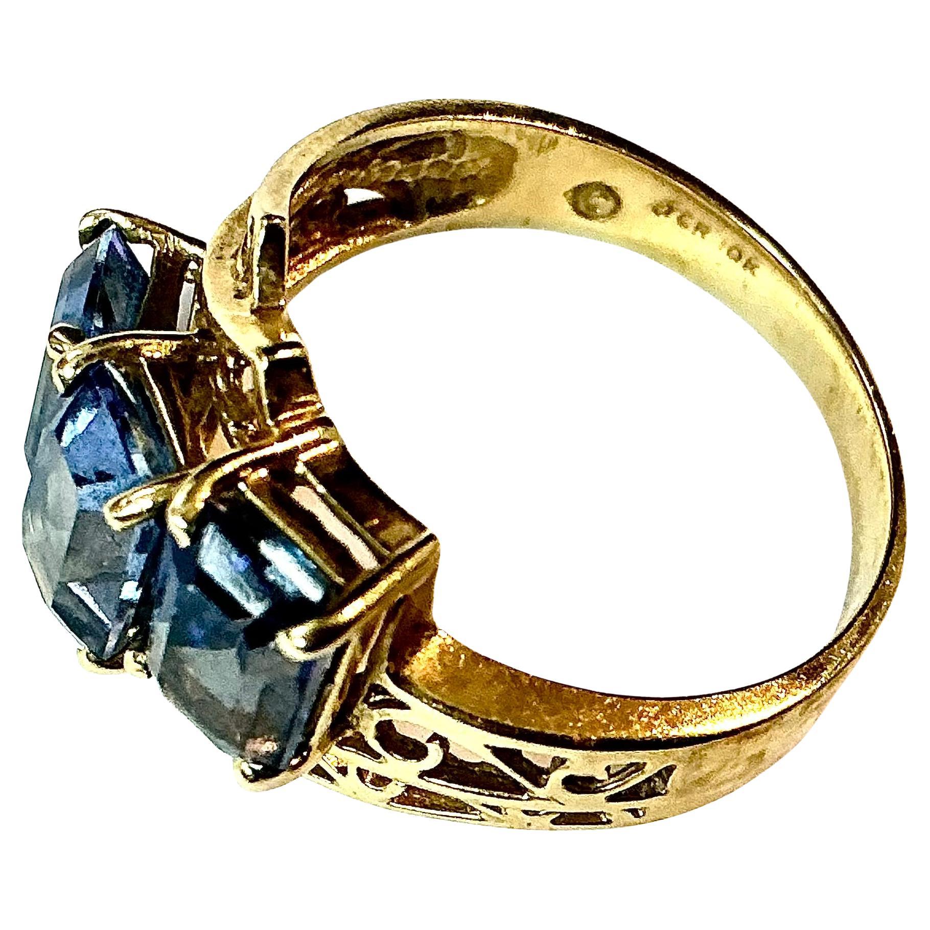 Women's Three Stone Blue Topaz 10K Yellow Gold Ring For Sale