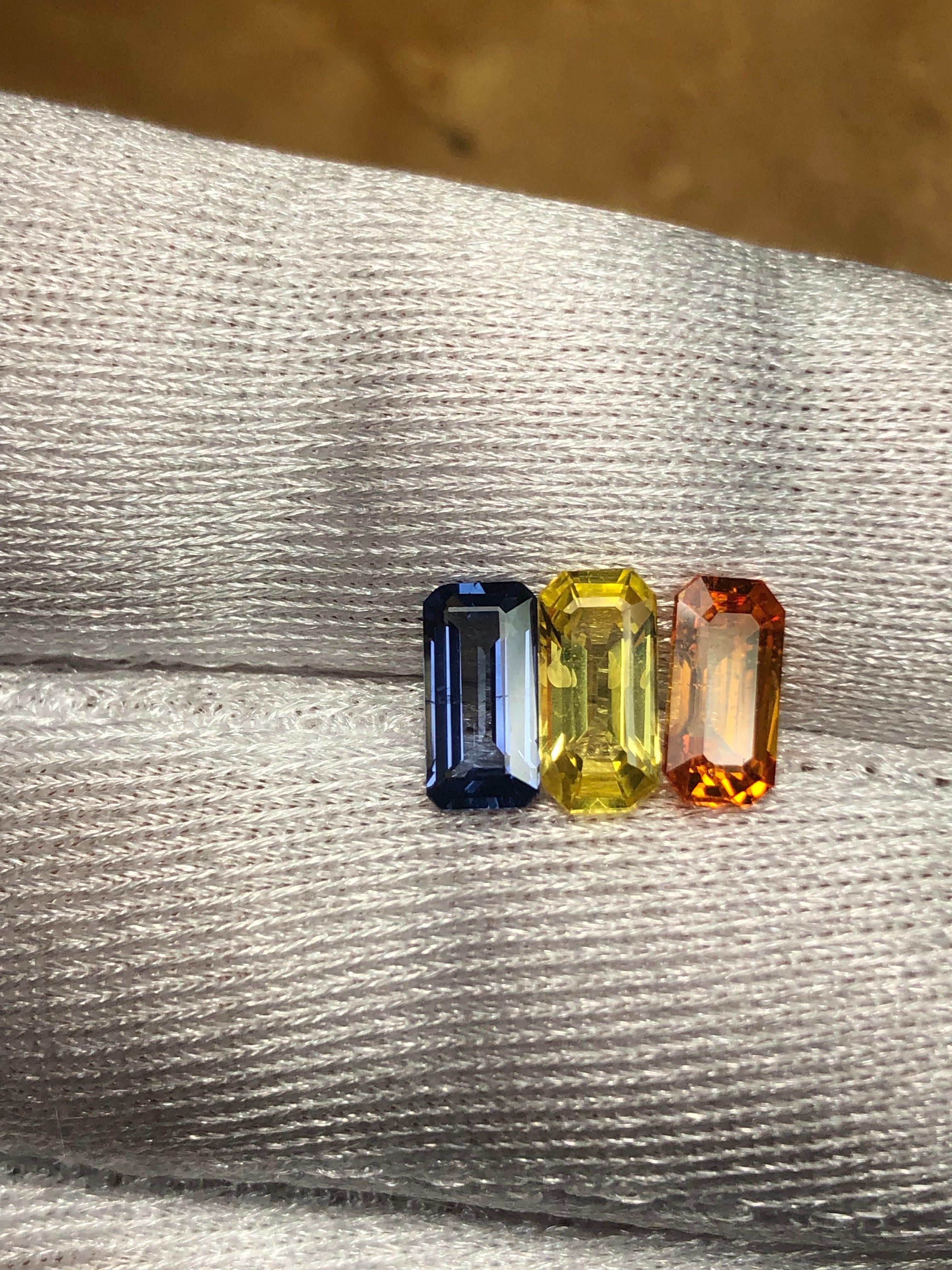Emerald Cut Multicolor Three Stone Ceylon Sapphire 3.17 Carat For Sale