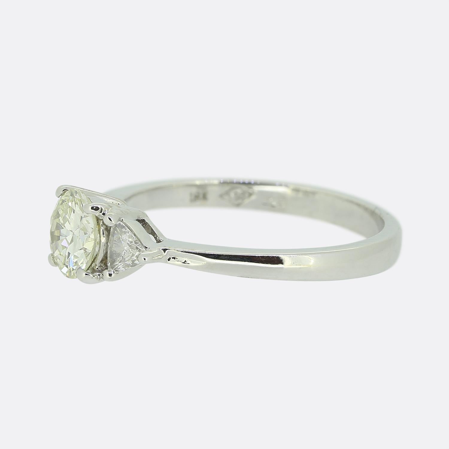 Here we have an 18ct white gold, three stone diamond engagement ring. The focal point of the ring is a raised round brilliant cut diamond set in a 4 clawed mount. Each shoulder of the ring plays host to a trillion cut diamond.

Condition: Used