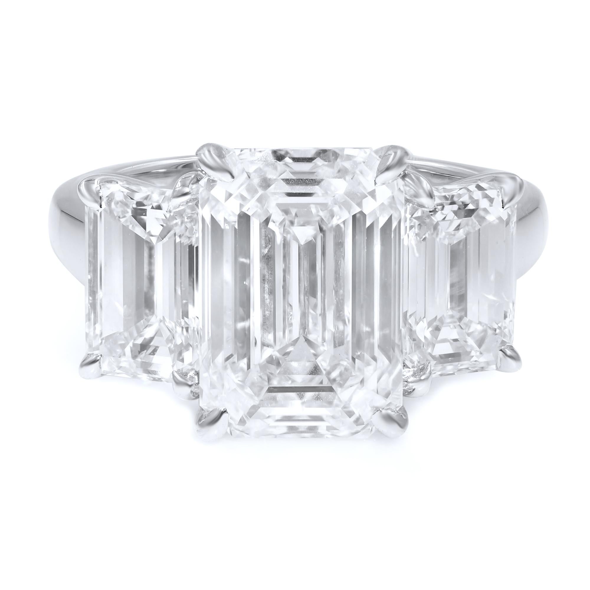 Three matching emerald cut stones create a stunning, but subtle, engagement piece. 

This ring was a custom piece. At the time we made this listing this ring was still available. Inquire within if we still have it.  
Please allow 4-6 weeks for