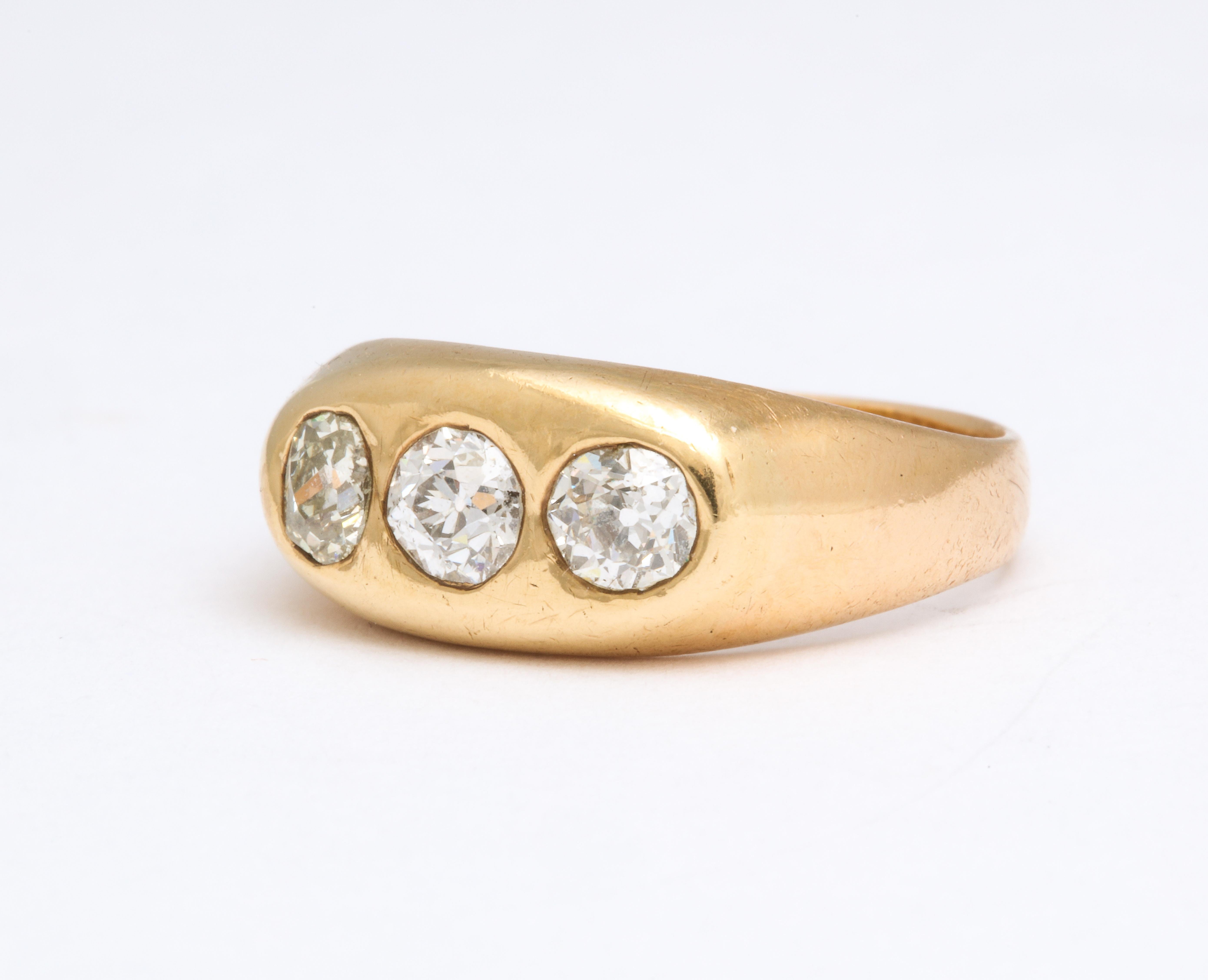 A classic three stone diamond Gypsy Ring with mine cut diamonds in a slightly tapered 14K mounting.
This classic ring can be stacked or worn on its own.