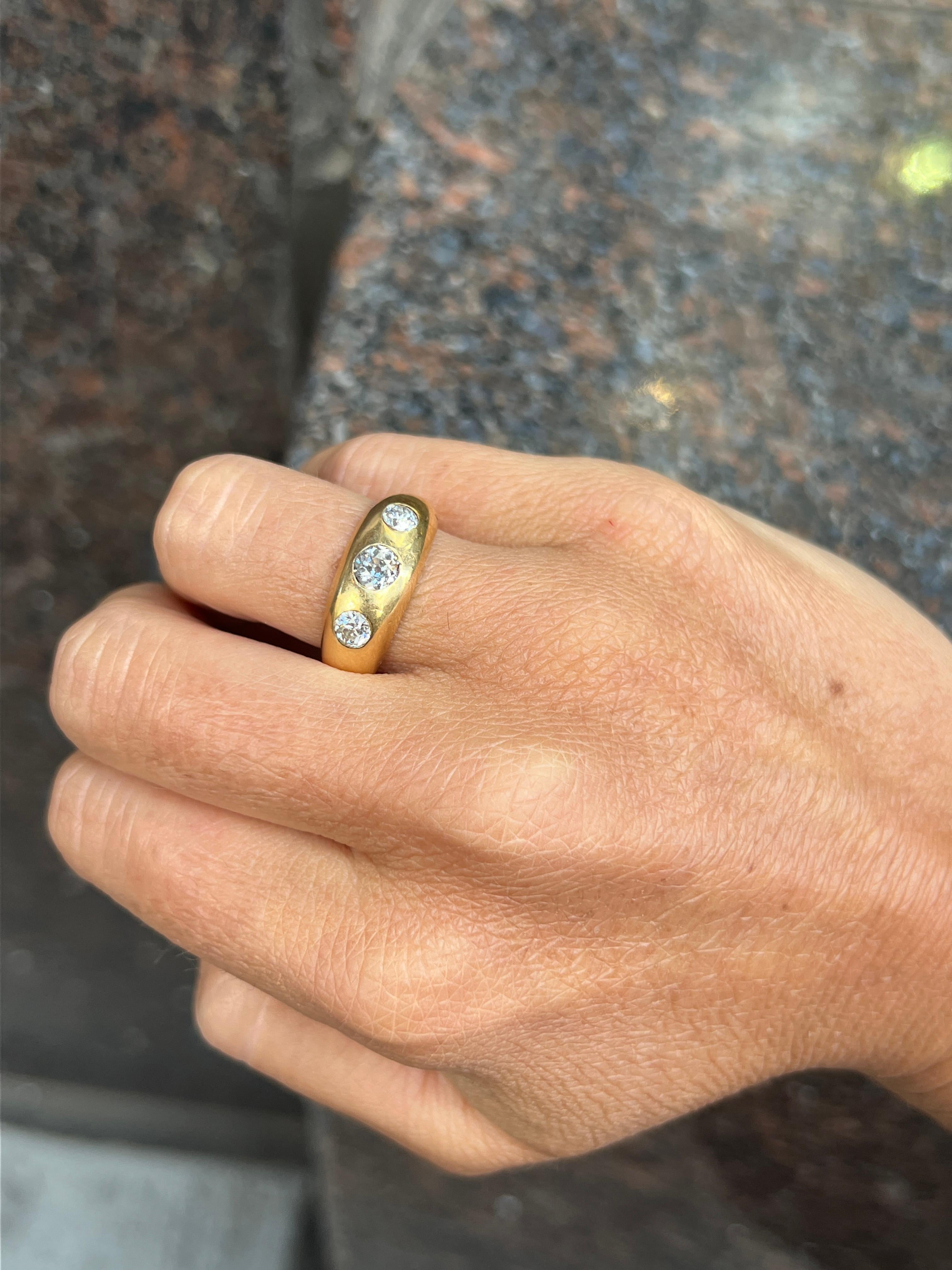 Three Stone Diamond Gypsy Ring

A gold band featuring a round cut center diamond with 2 smaller round cut diamonds on each side.

Center Diamond Weight: approximately .35 carats 
Side Diamond Weight: approximately .40 carats total

Ring Size: