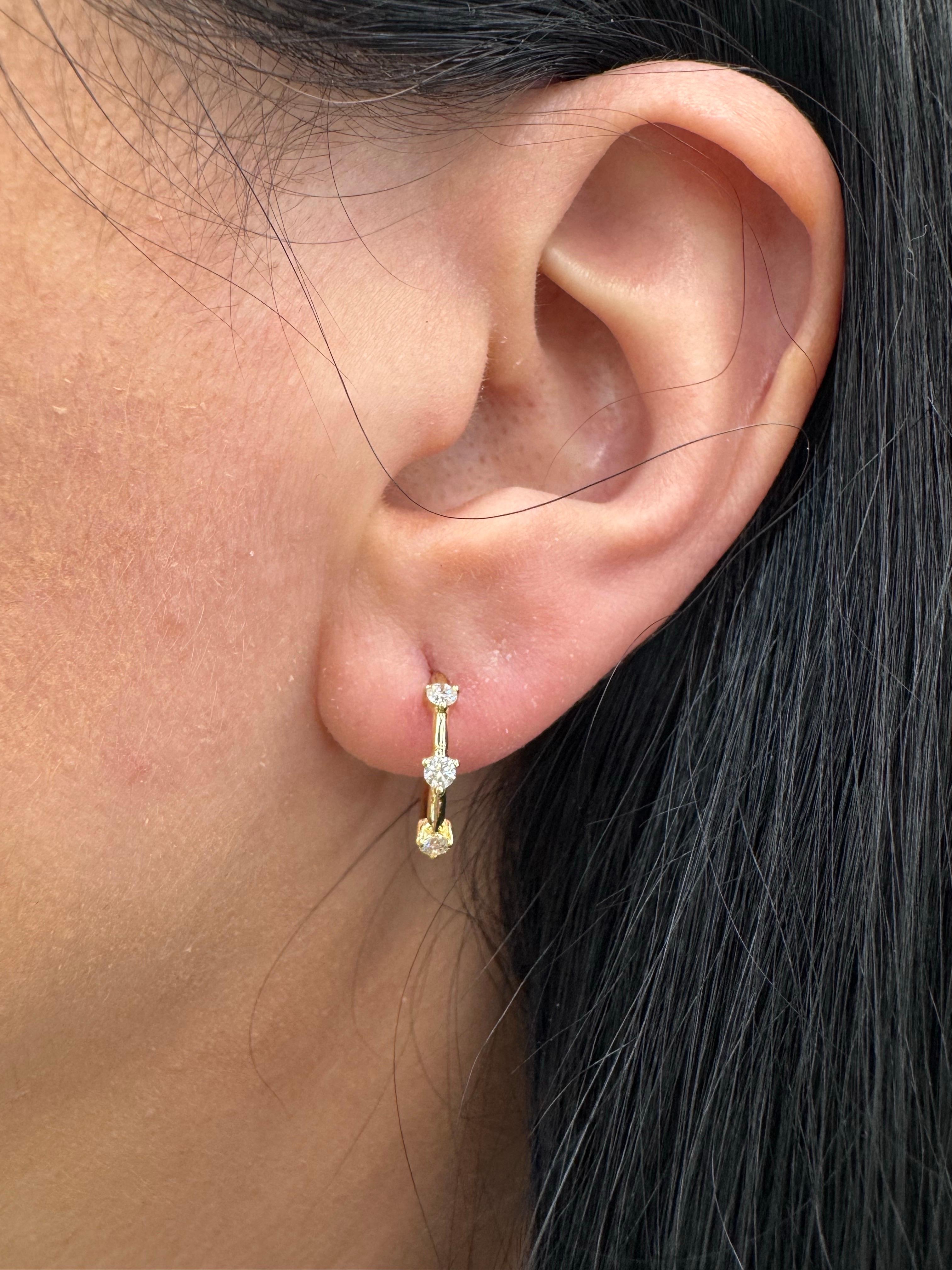 Contemporary Three Stone Diamond Huggie Hoop Earrings 0.32 Carats 14 Karat Yellow Gold For Sale