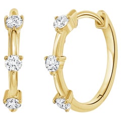 Créoles Huggie en or jaune 14 carats avec trois pierres et diamants 0,32 carat
