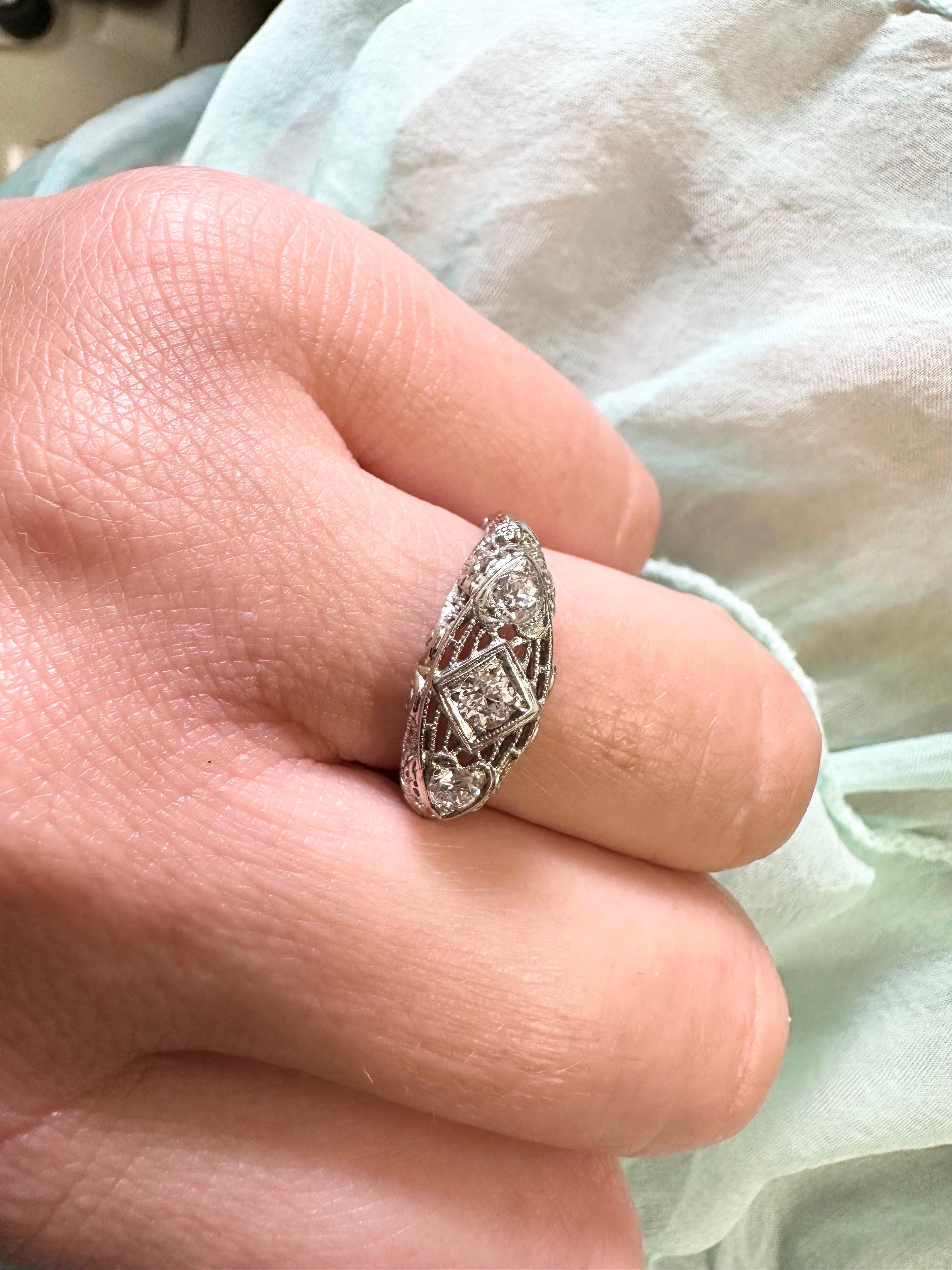 Three stone antique diamond ring in 18kt gold.

Natural Center Diamond(s): 
Color: F-G
Cut:Round
Carat: 0.25ct
Clarity: SI
Grams:2.9
Item: TNA
Certificate of authenticity comes with purchase

ABOUT US
We are a family-owned business. Our studio in