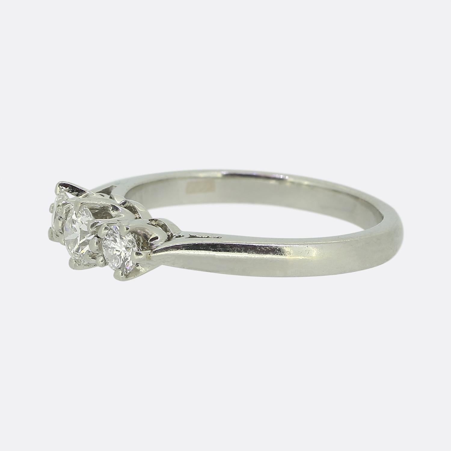 Here we have a platinum  three-stone diamond ring featuring a trio of round brilliant cut diamonds. The central stone (0.18ct) is set in a six pronged mount as are the two single matching (each 0.07ct) diamonds on either side.

Condition: Used (Very