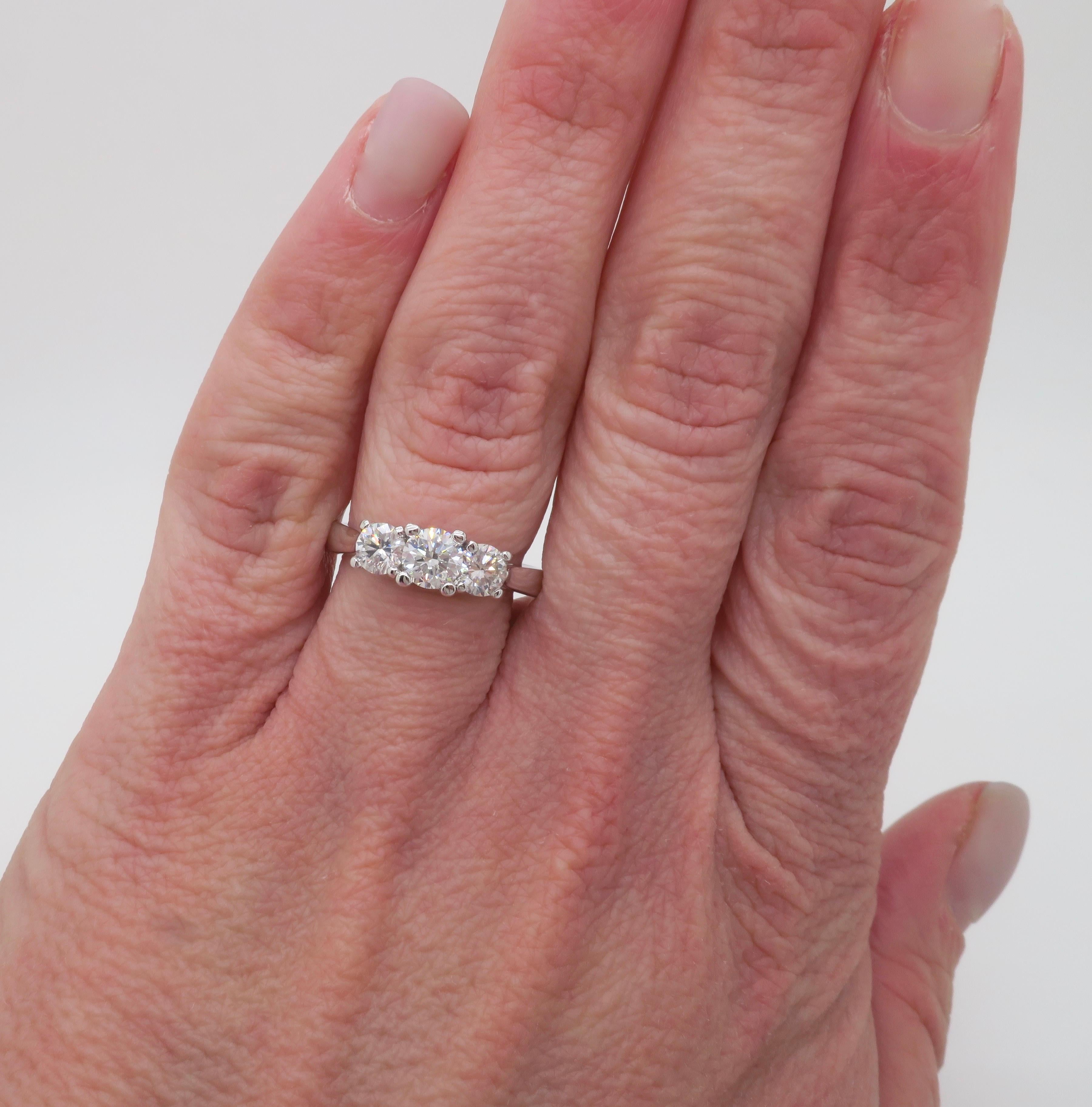 Classic three stone diamond ring crafted in white gold. 

Center Diamond Carat Weight: .40CT Earth Mined
Center Diamond Cut: Round Brilliant Cut 
Center Diamond Color: G
Center Diamond Clarity: SI2
Total Diamond Carat Weight: .92CTW
Accent Diamonds:
