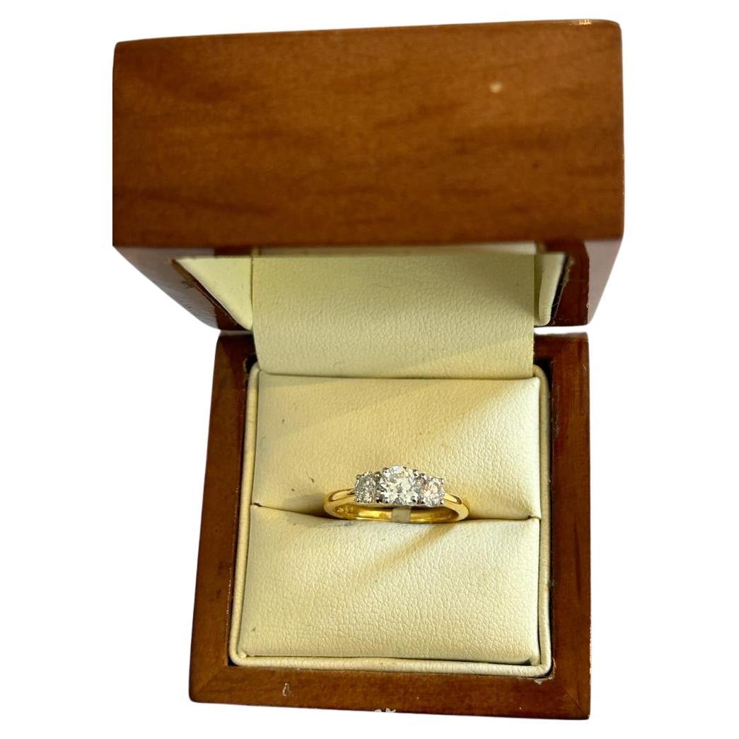 This pretty three stone diamond ring is set in 18K Yellow Gold.  Est 0.88ct and comes in US Size 5/1/2 and UK size K.

