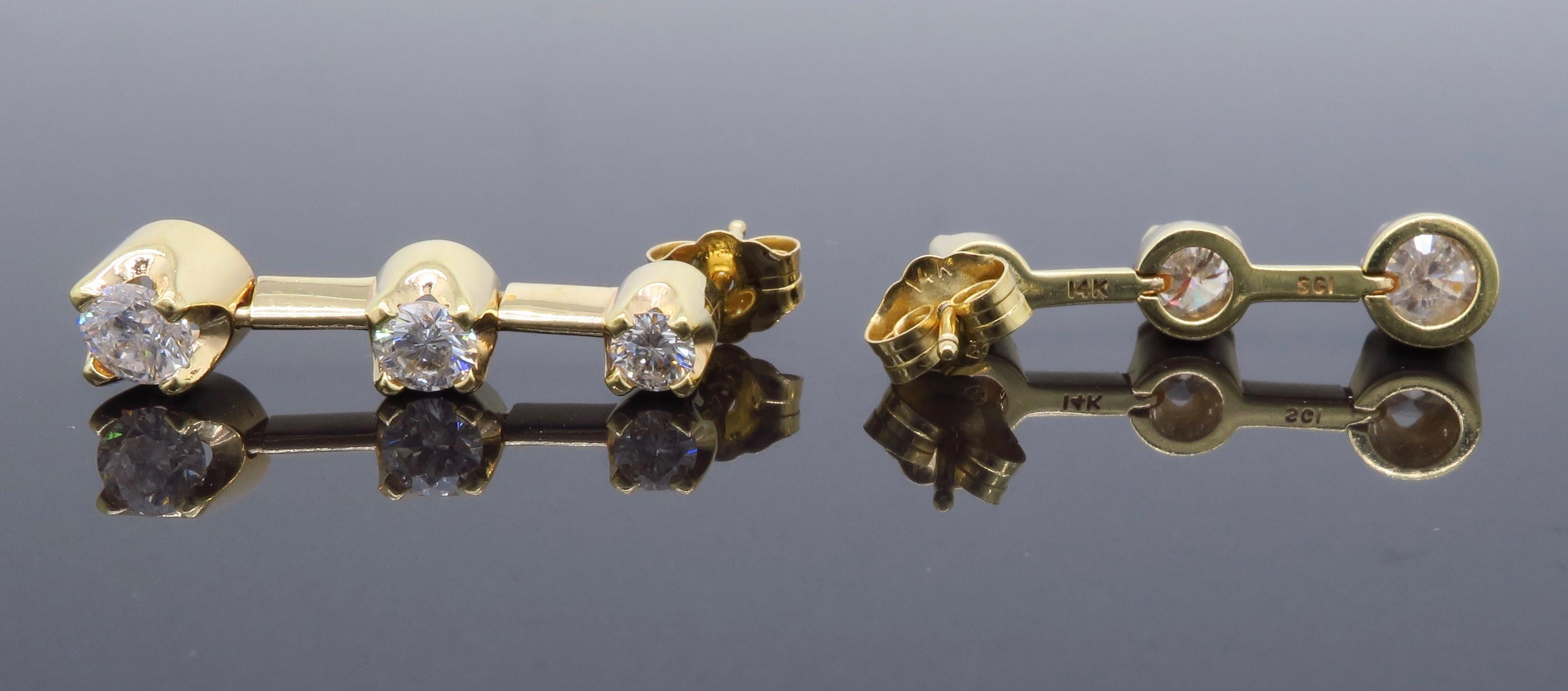 three diamond drop earrings