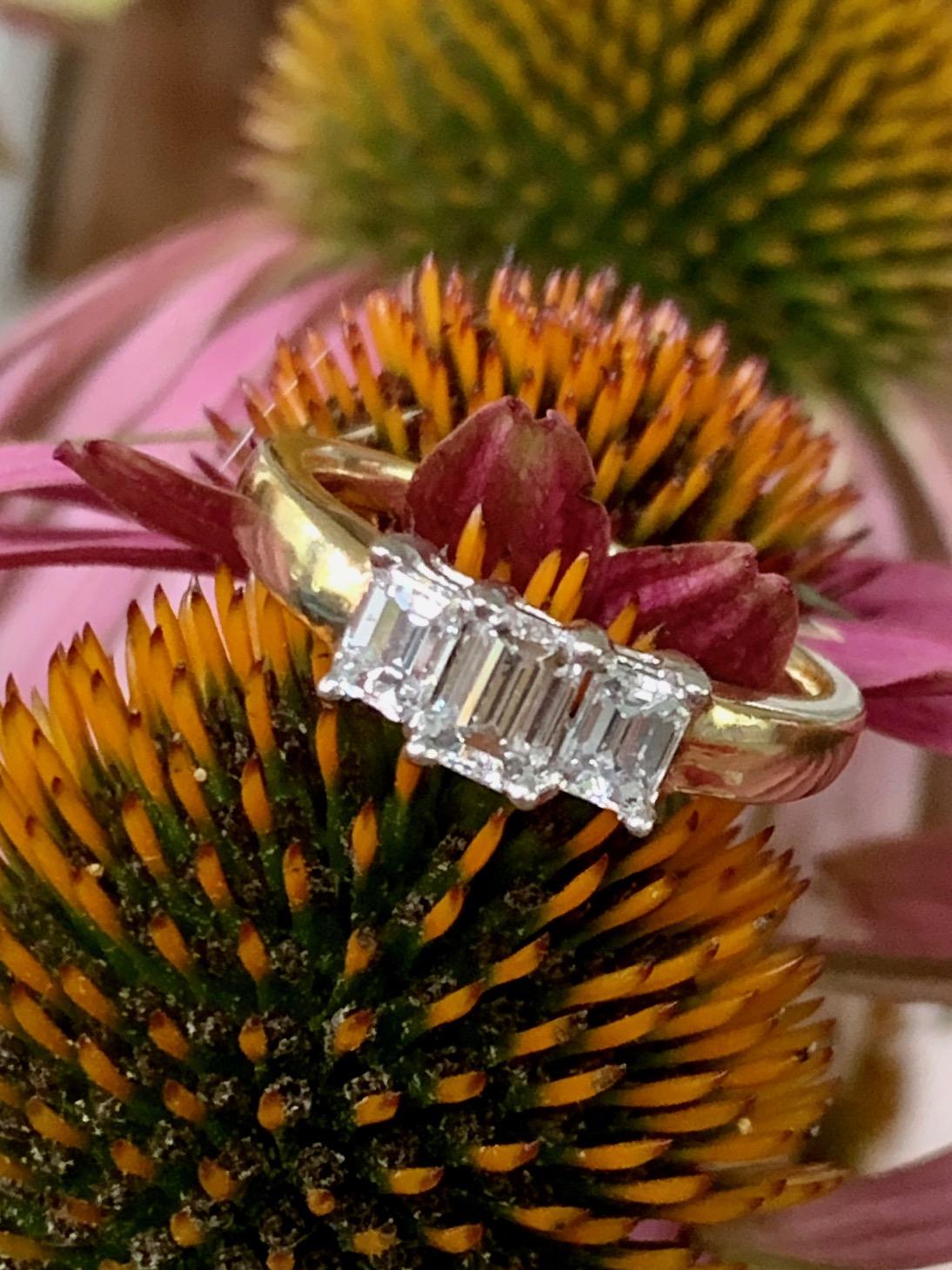 This stunning three-stone Diamond ring features Emerald cut Diamonds with a total weight of 1.10ctw.  The center Diamond is approximately .50ct. The side Diamonds are each approximately .30ct.

Weight: 5.1 grams
Size: 8 - -This ring can be resized,