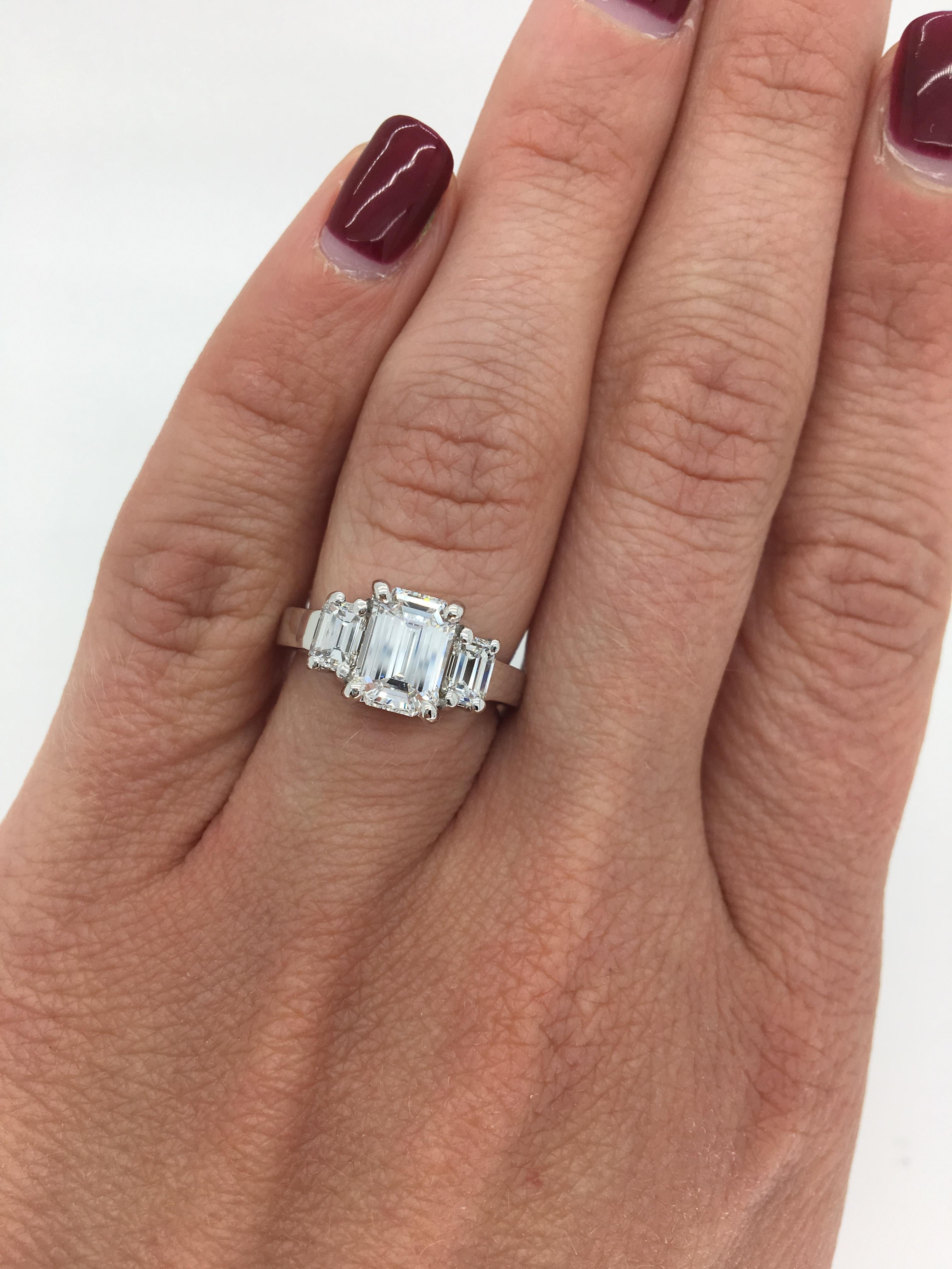 This timeless three stone diamond ring features a beautiful GIA Certified 1.32CT Emerald Cut Diamond.

AGS Certified: 601302438001
Center Diamond Carat Weight: 1.32CT
Center Diamond Cut: Emerald
Center Diamond Color: F-G
Center Diamond Clarity: 