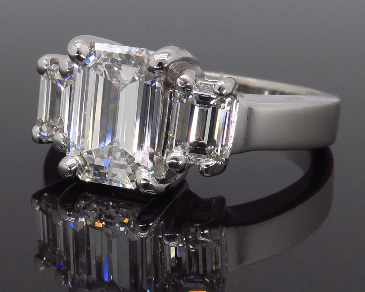 emerald cut diamond three stone ring