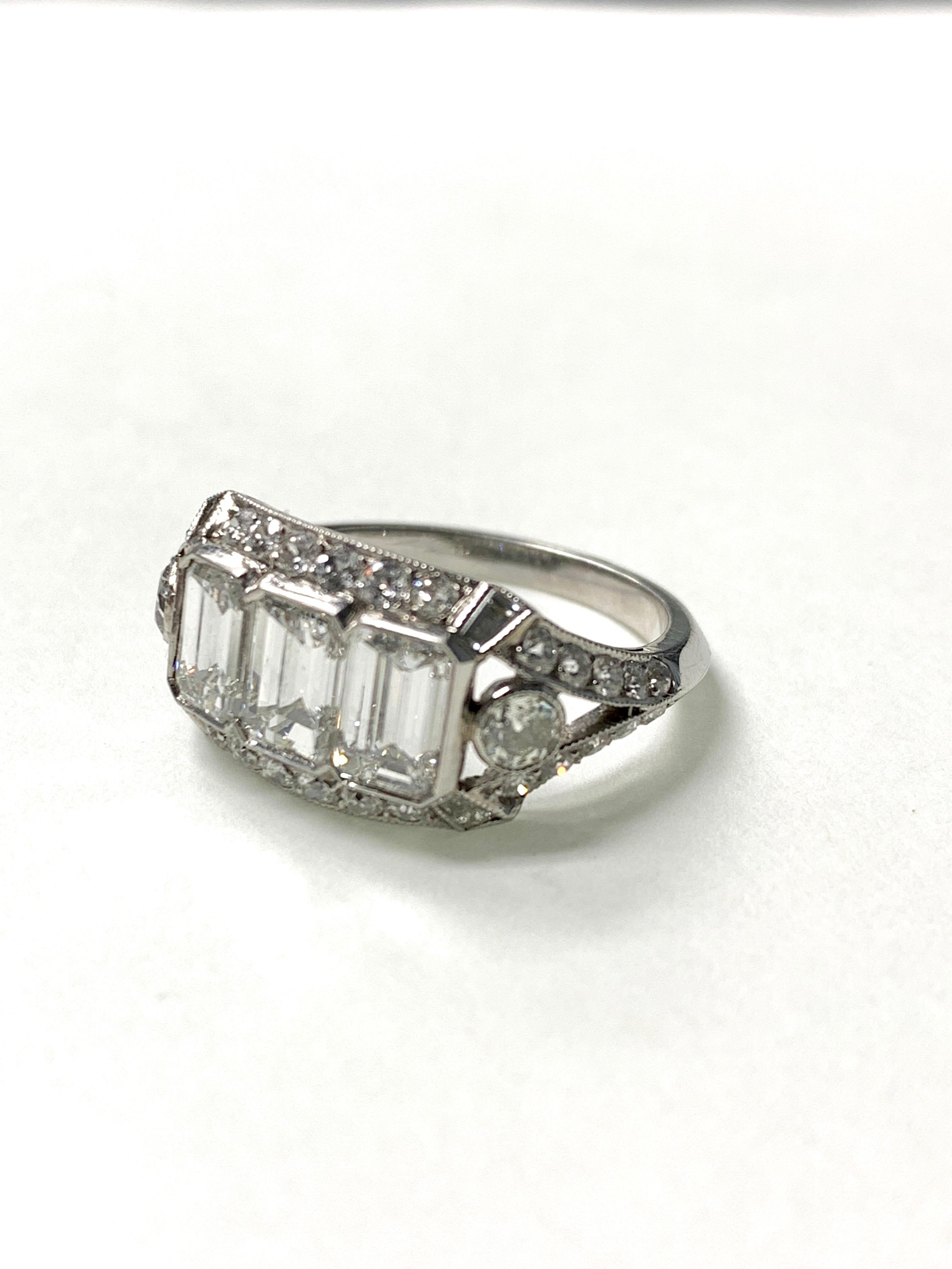 Three-Stone Emerald Cut Diamond Engagement Ring in Platinum In New Condition For Sale In New York, NY