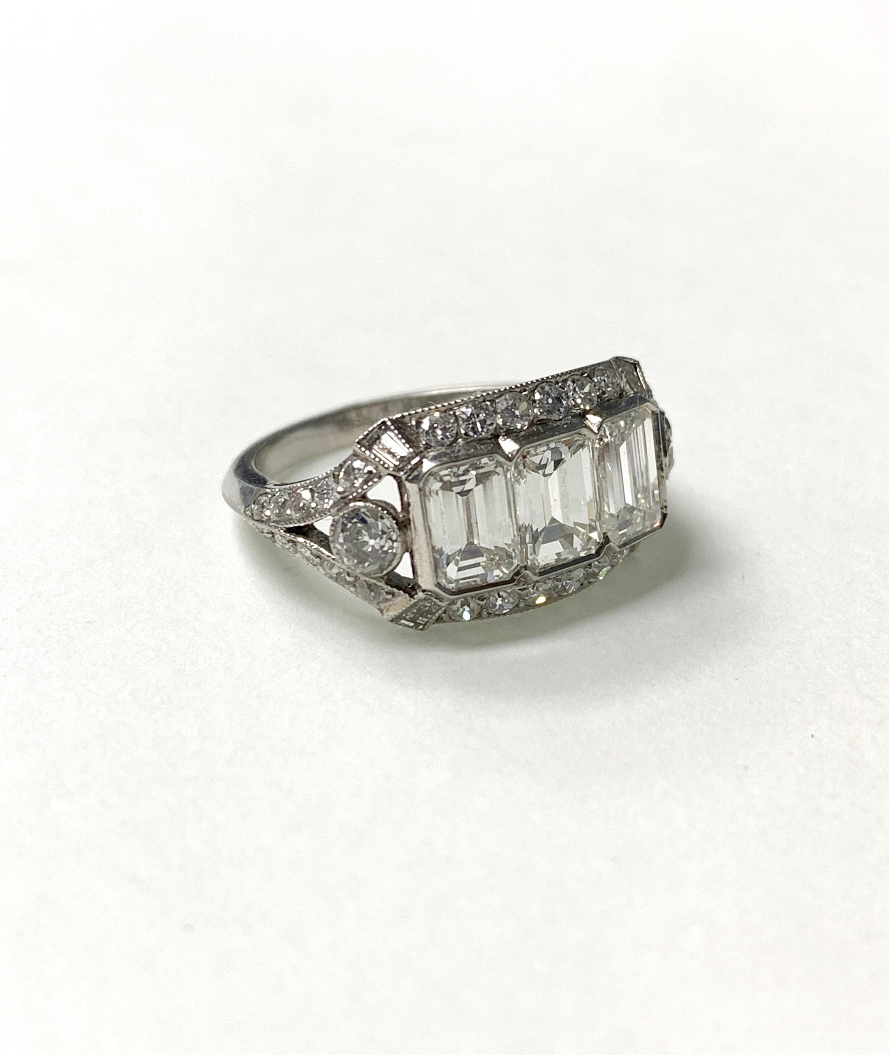 Women's Three-Stone Emerald Cut Diamond Engagement Ring in Platinum For Sale