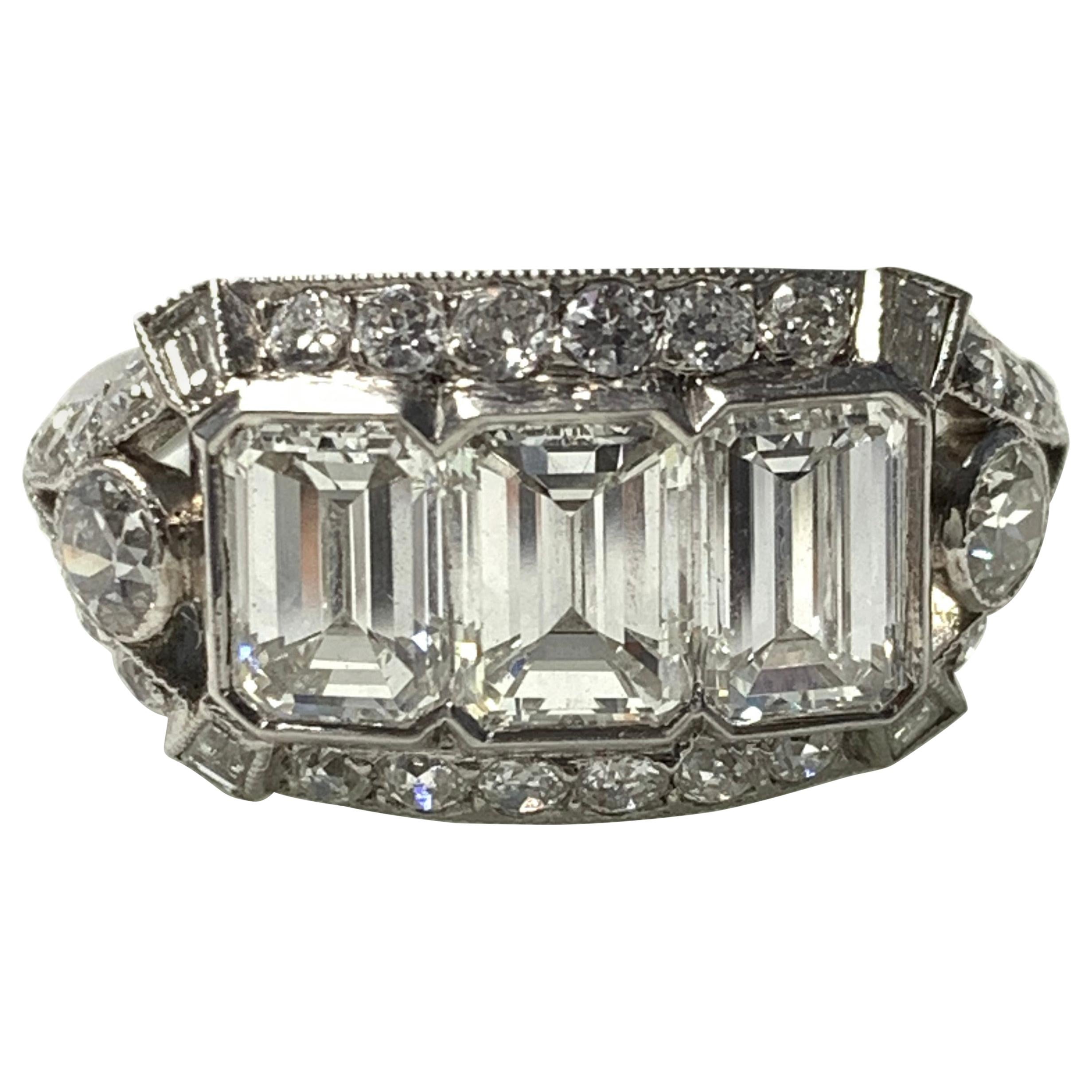 Three-Stone Emerald Cut Diamond Engagement Ring in Platinum