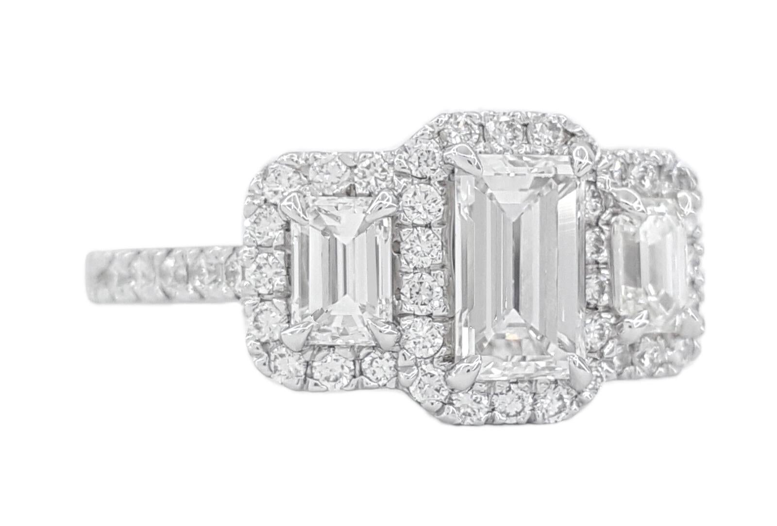 Three Stone Emerald Cut Diamond HaloEngagement Ring in 14k White Gold.



The ring weighs 3.6 grams, size 6, the center stone is a Natural Emerald Cut Diamond weighing 0.71 ct, F in color, SI1 in clarity, measurements of the center stone are 6.60 x