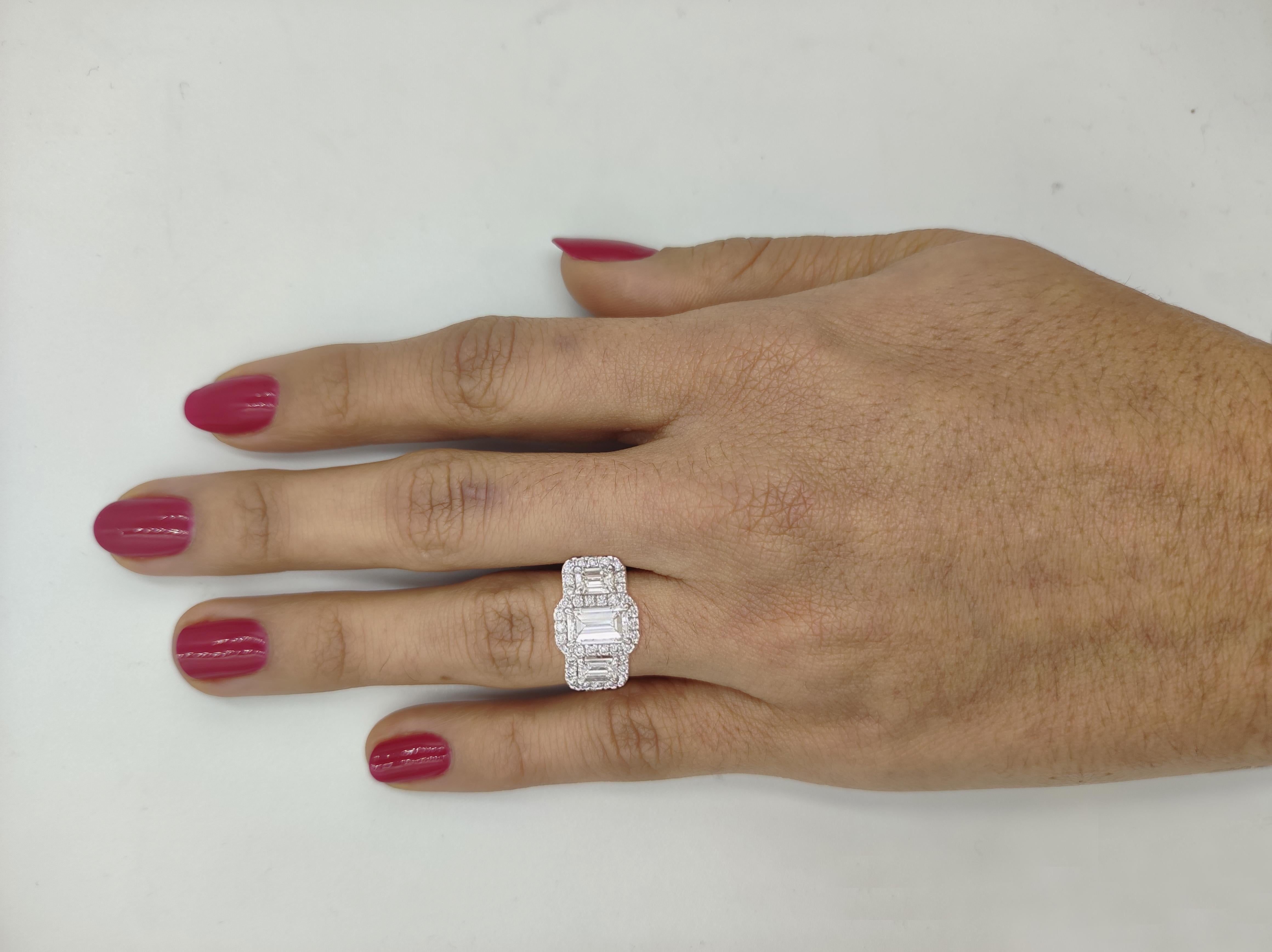 Modern Three Stone Emerald Cut Diamond Halo Engagement Ring For Sale