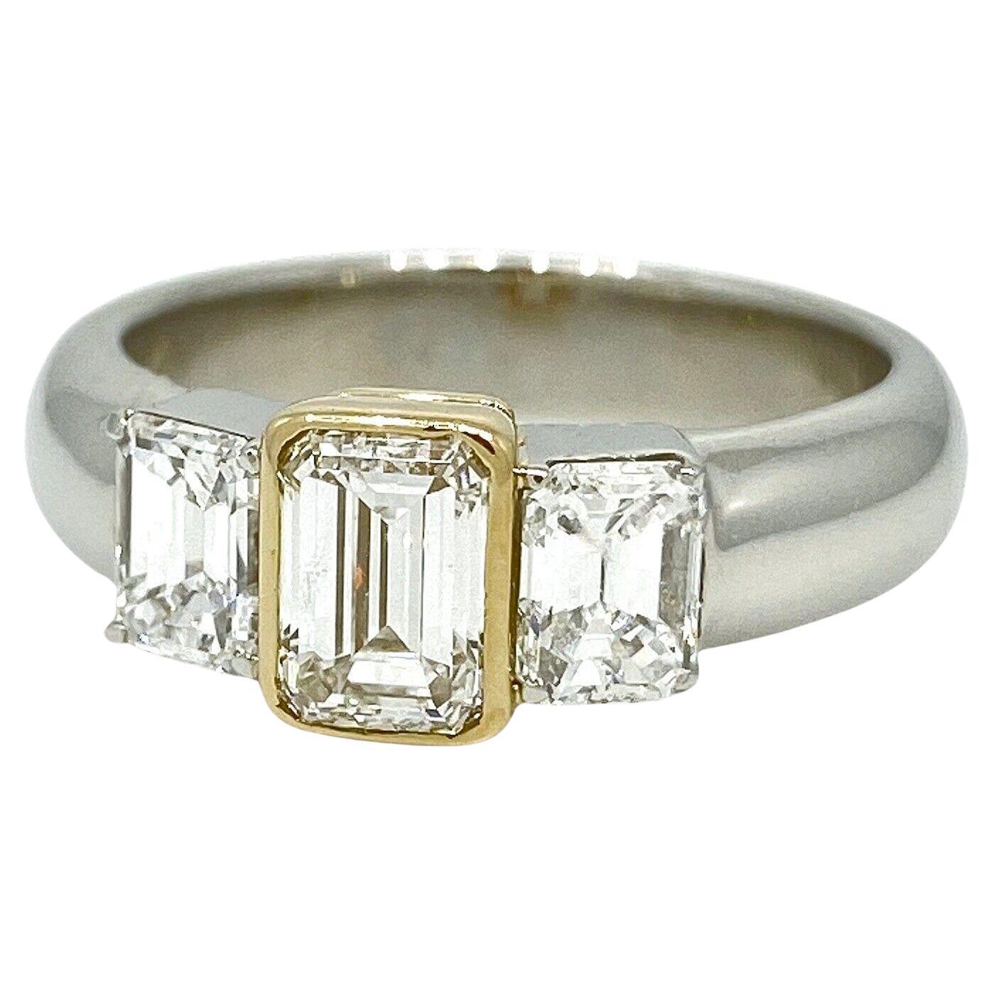 Three Stone Emerald Cut Diamond Ring in Platinum and 18k Yellow Gold For Sale