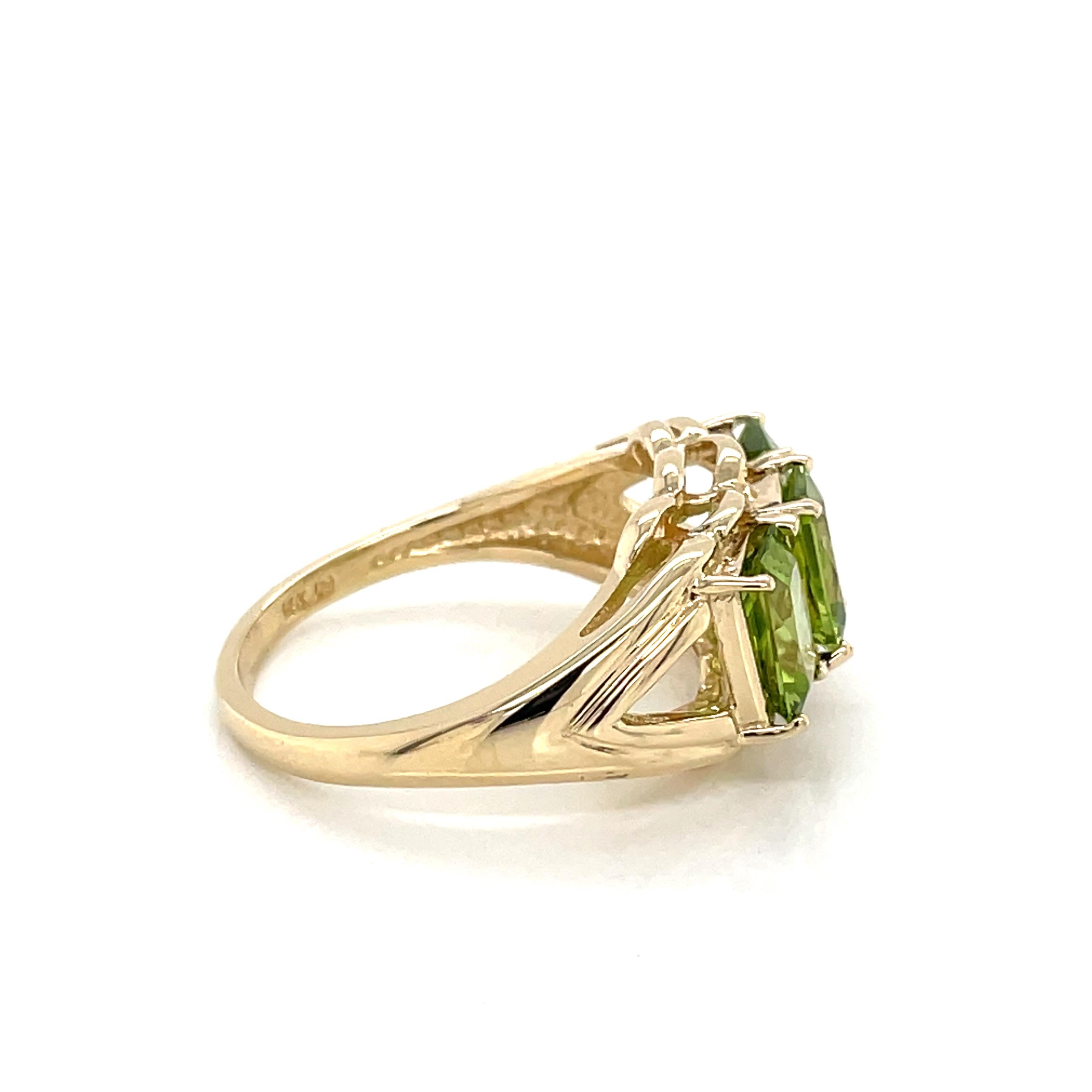 Women's Three Stone Emerald Cut Peridot 14 Karat Yellow Gold Ring