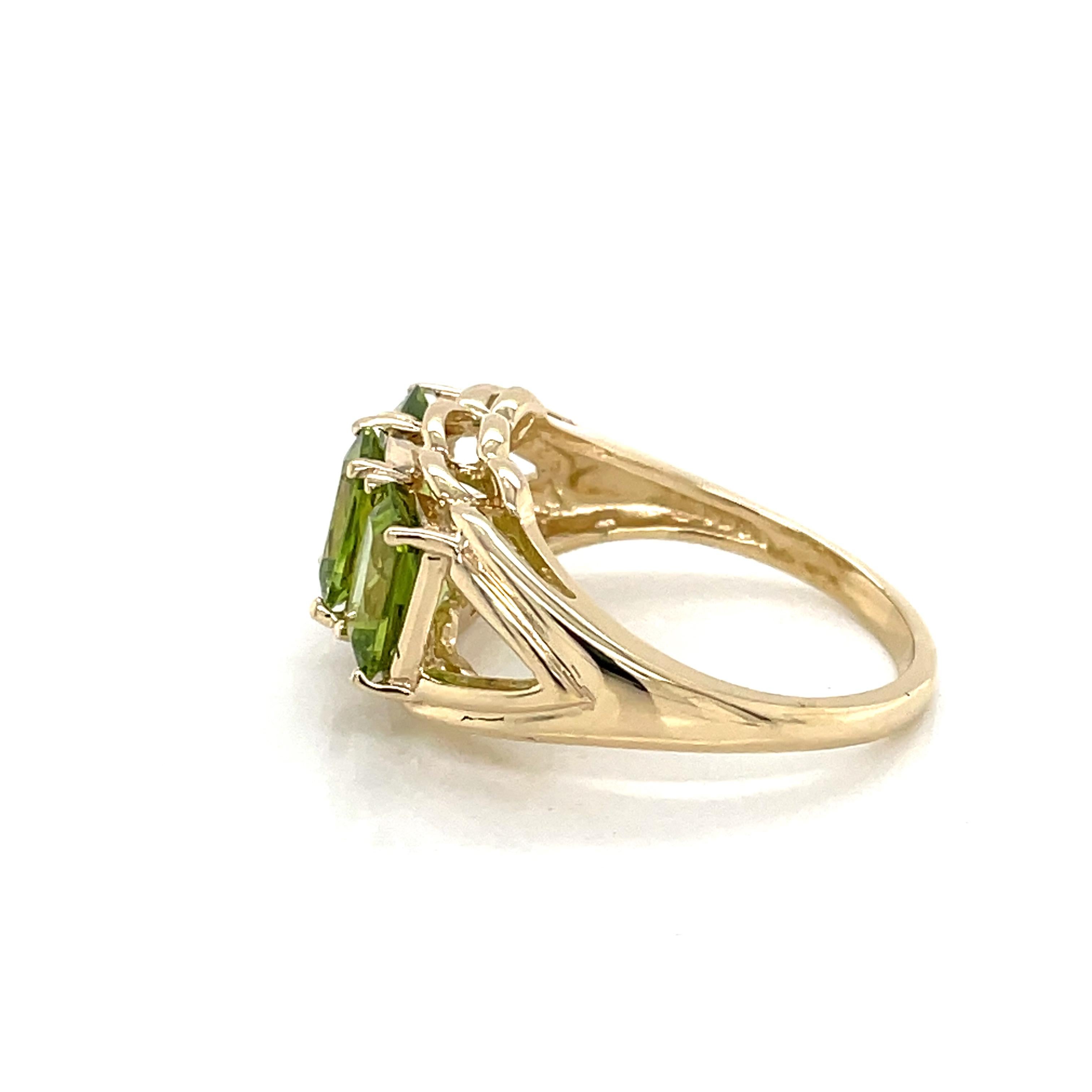 Three Stone Emerald Cut Peridot 14 Karat Yellow Gold Ring 1