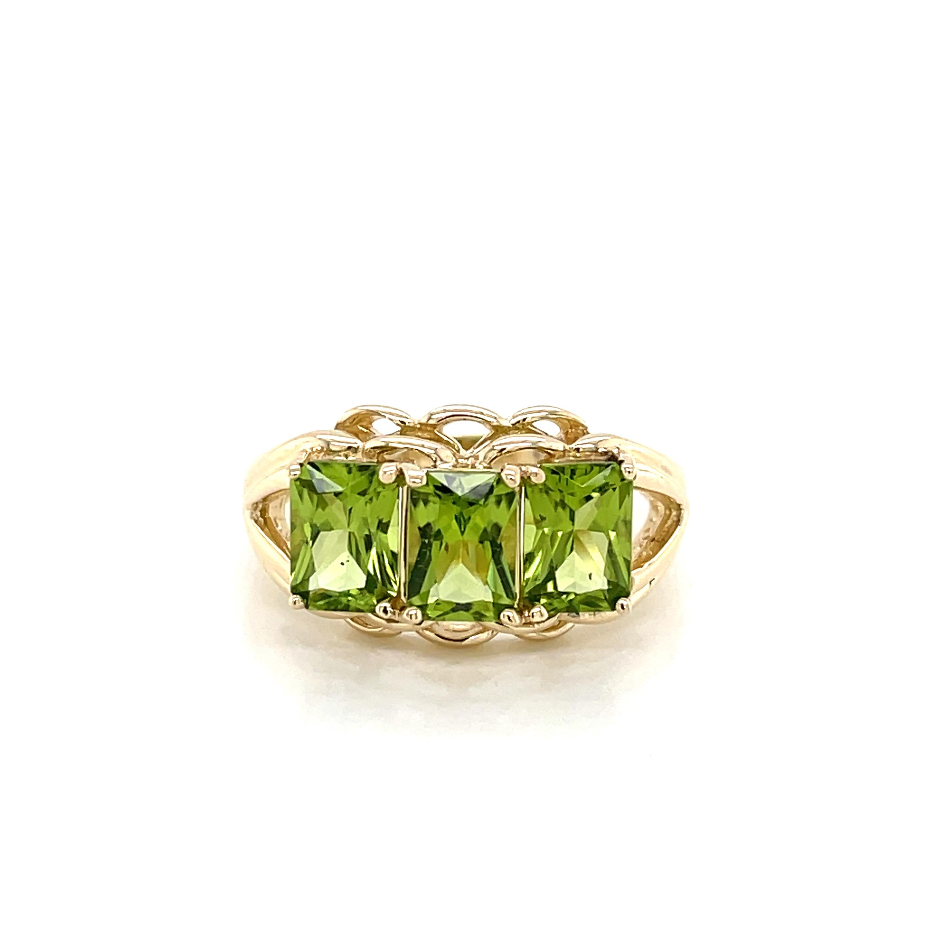 Three Stone Emerald Cut Peridot 14 Karat Yellow Gold Ring 2