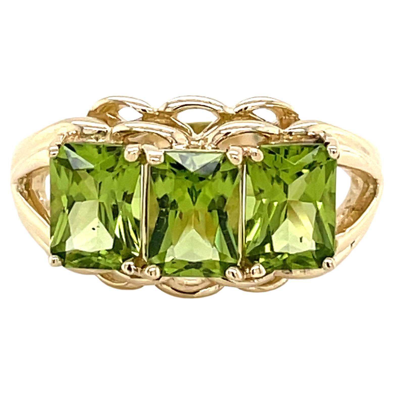 Three Stone Emerald Cut Peridot 14 Karat Yellow Gold Ring