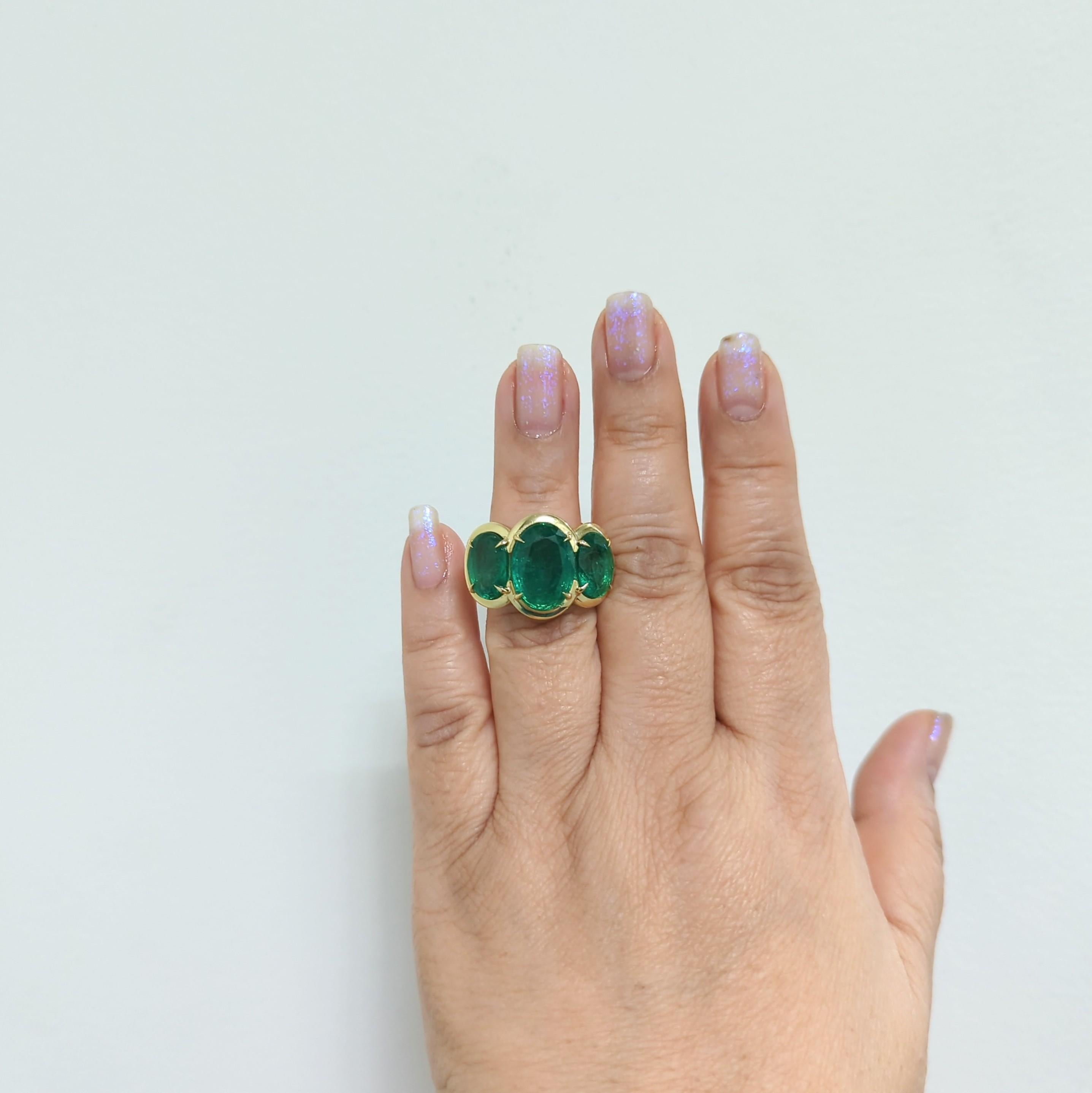Gorgeous 15.18 ct. emerald ovals in a handmade 18k yellow gold mounting.  Ring size 6.5.