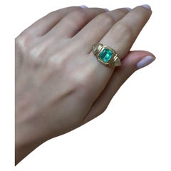 Three stone emerald ring with trillion diamonds, 18k gold