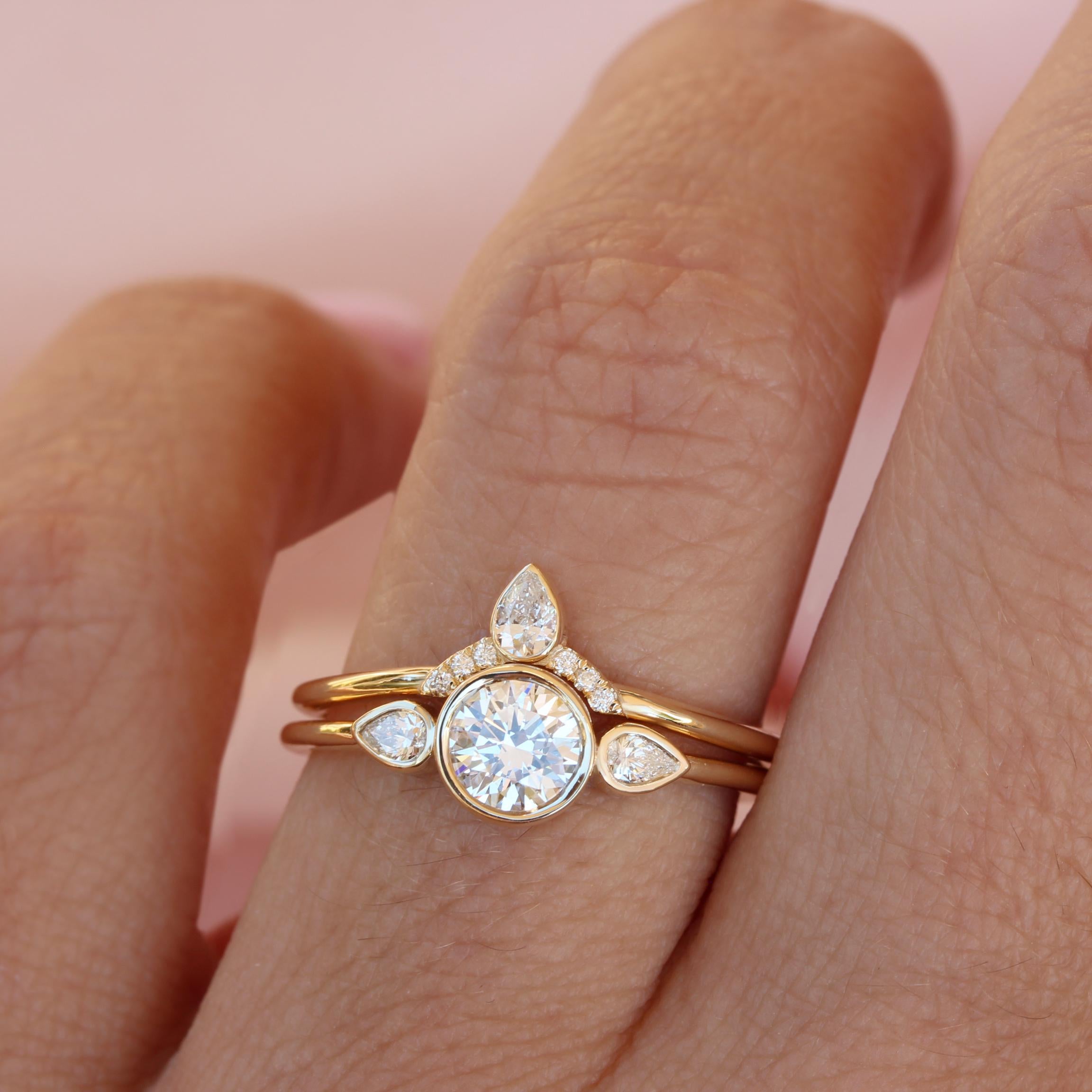 Minimalist Three Stone Engagement Moissanite Bezel Two Ring Set.
An original design by Silly Shiny Diamonds.
This list is for the two ring set.
Hand made with care. 
An original design by Silly Shiny Diamonds. 

Details:
* Center stone shape: Round
