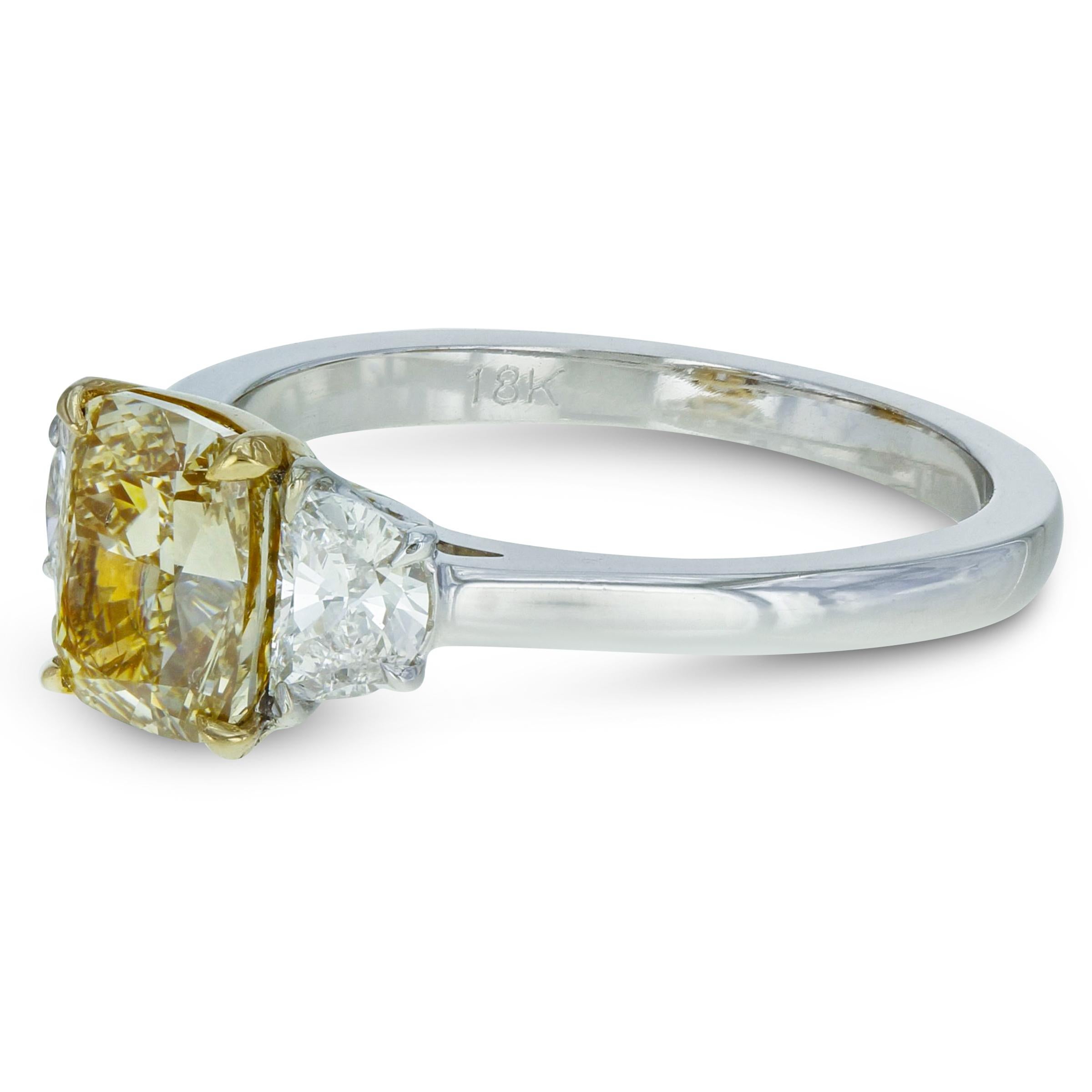 Fancy Yellow Three Stone Diamond Engagement Ring. GIA.
This rich lemon-yellow color is extraordinary: captivated in our three stone diamond engagement ring. GIA certified we guarantee quality and high end finishes. Flanked by half moon cut diamonds