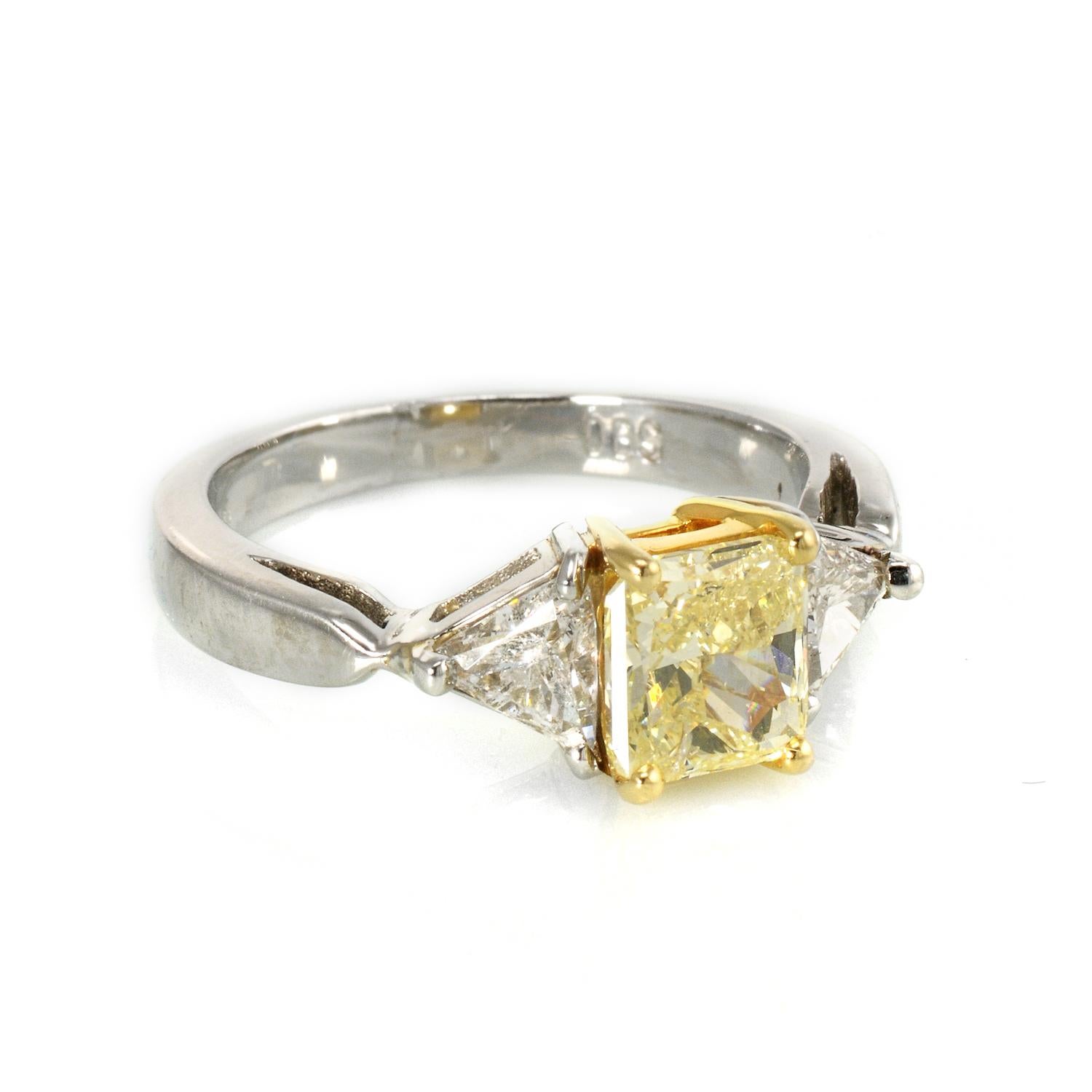 Modern Three-Stone Fancy Yellow Diamond Engagement Ring in Platinum