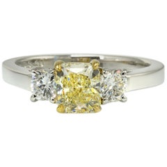 Three-Stone Fancy Yellow Radiant Cut Diamond and Round Sides Engagement Ring