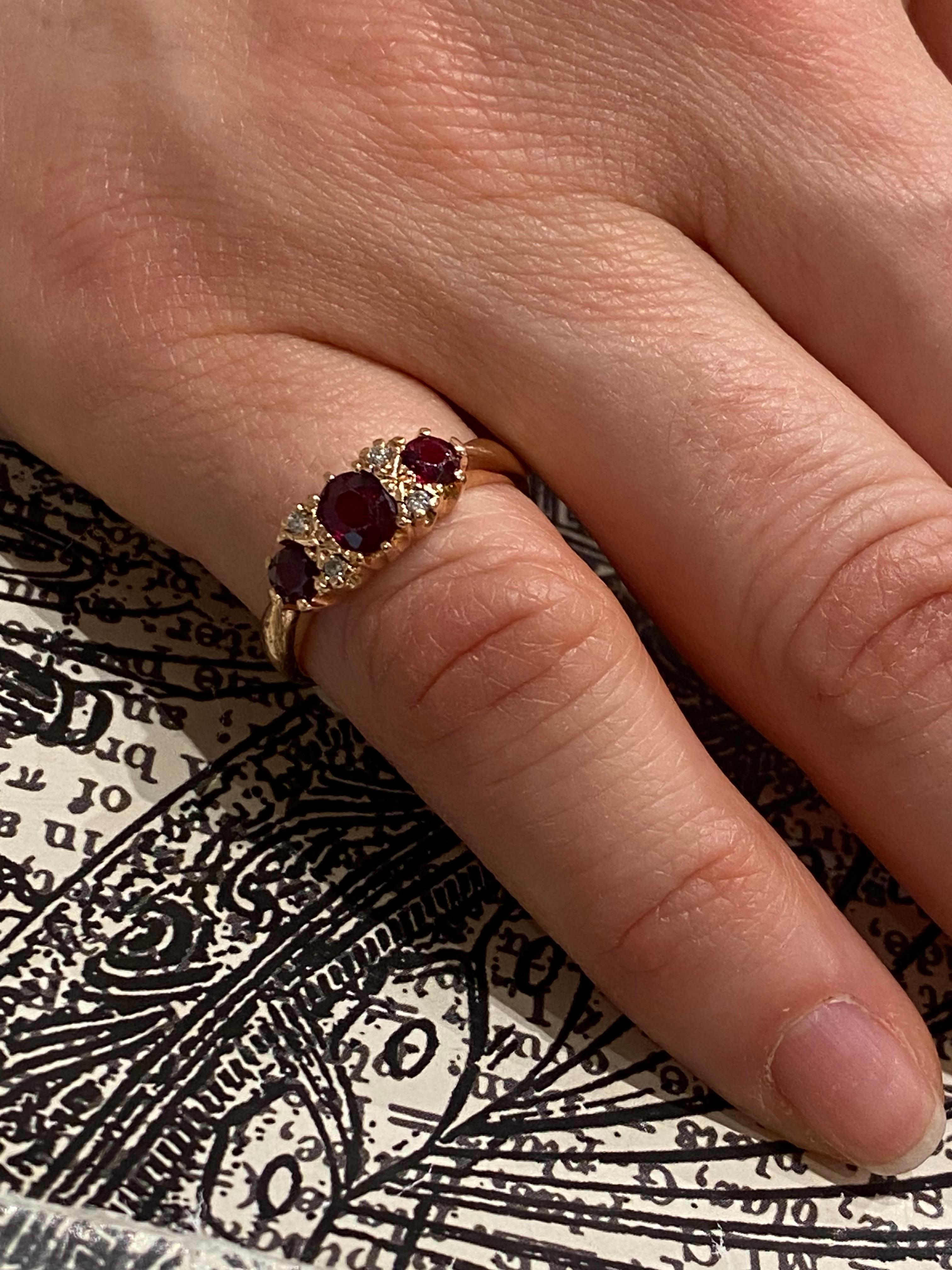 Oval Cut Three-Stone Half Hoop 0.85ct Thai Ruby & Diamond Retro Ring in 9K Rose Gold.