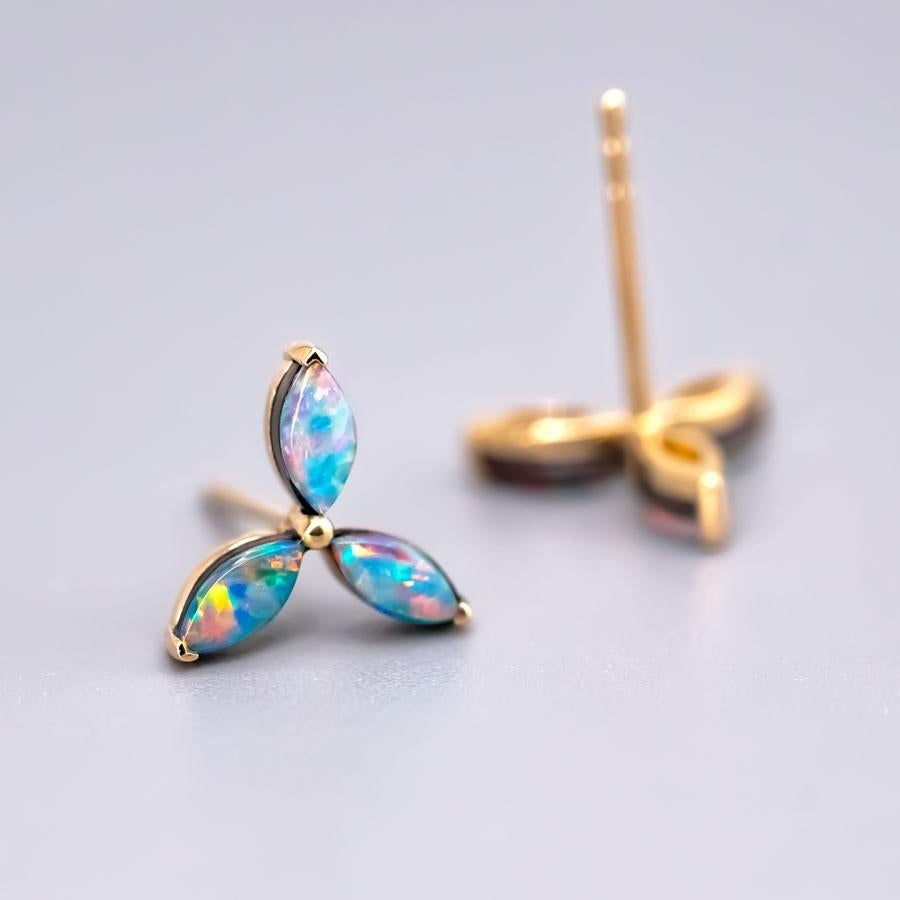 Three Stone Marquise Australian Doublet Opal Stud Earrings 18K Yellow Gold.


Free Domestic USPS First Class Shipping!  Free One Year Limited Warranty!  Free Gift Bag or Box with every order!



Opal—the queen of gemstones, is one of the most