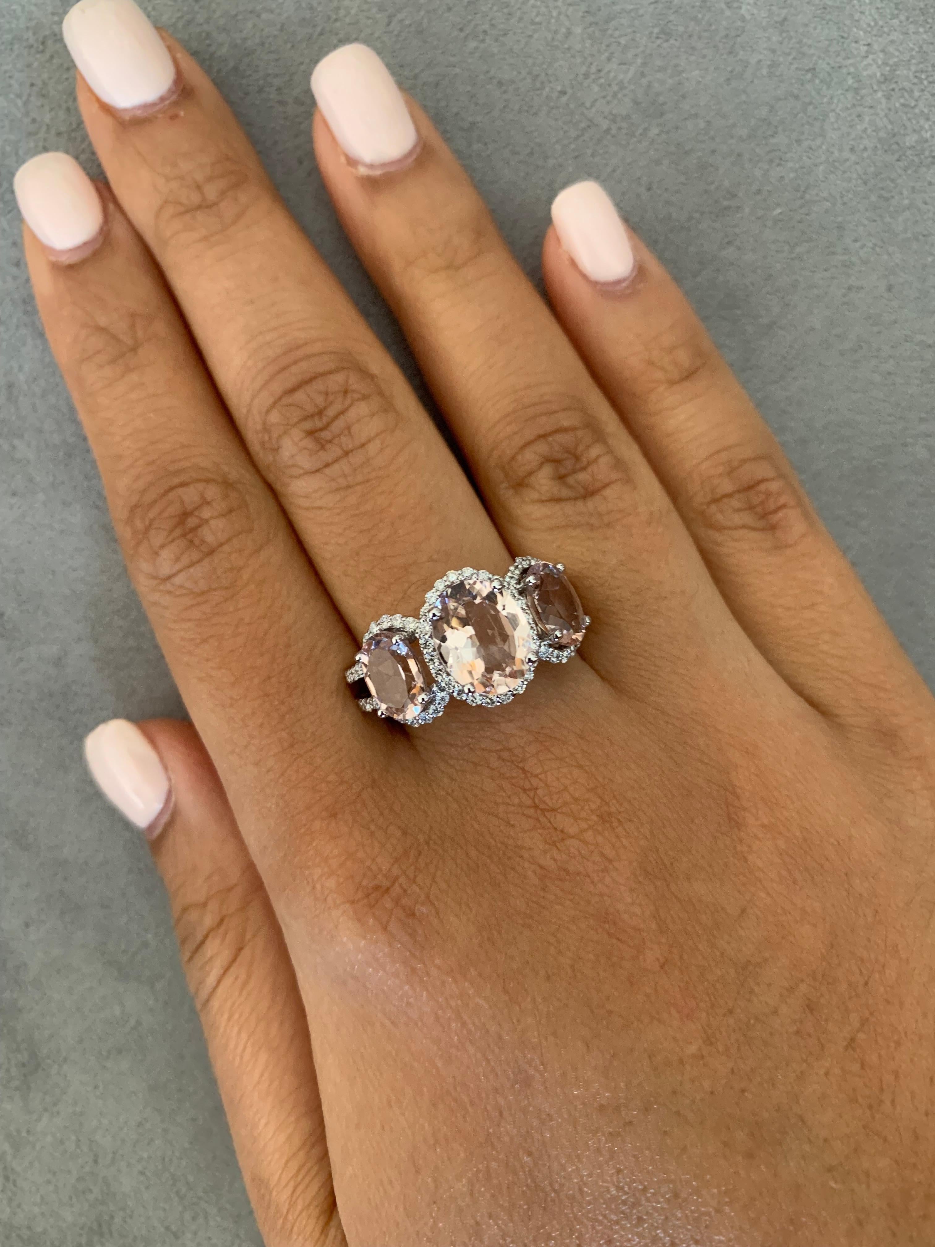 This collection features an array of magnificent morganites! Accented with diamonds these rings are made in white gold and present a classic yet elegant look. 

Three stone morganite ring in 18K white gold with diamonds. 

Morganite: 2.1 carat oval