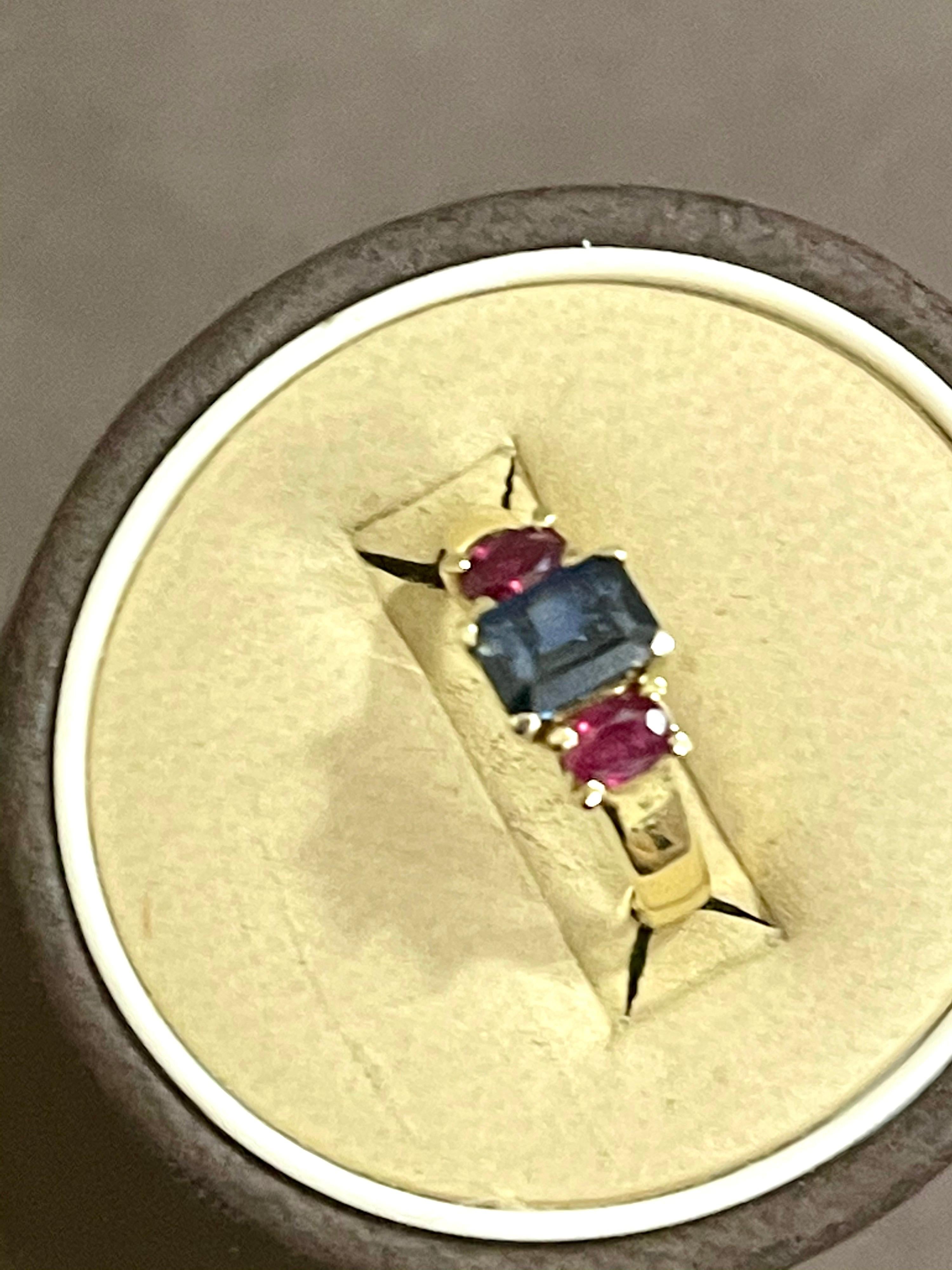 Emerald Cut Three-Stone Natural Blue Sapphire and Ruby Engagement Ring in 14 Karat Gold
