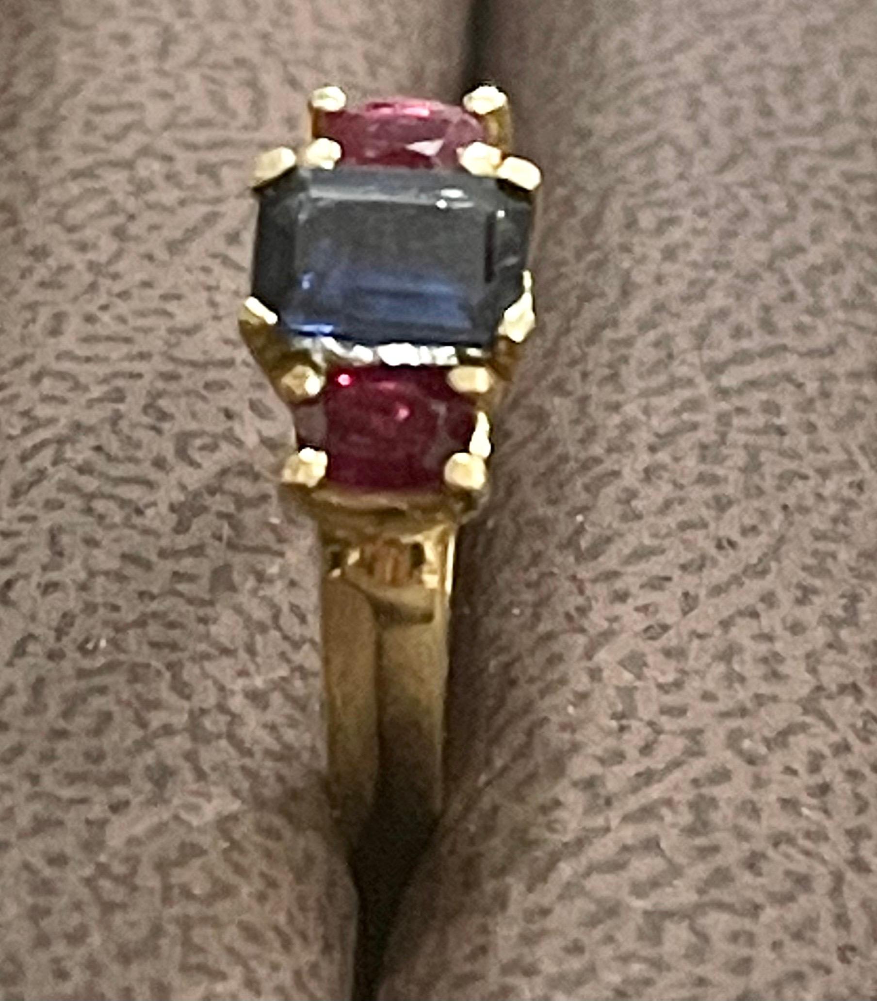 Three-Stone Natural Blue Sapphire and Ruby Engagement Ring in 14 Karat Gold In Excellent Condition In New York, NY