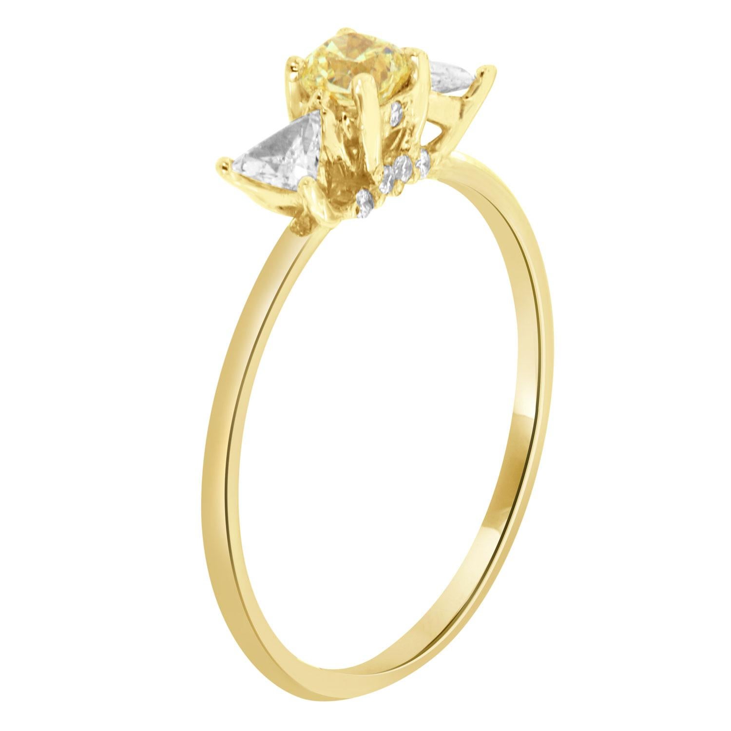 This 14k delicate ring features a 0.22 Carat Square Cushion yellow diamond flanked by two 0.14 Carat pointed Trillion-shaped diamonds. A 0.05 Carat 1.00 mm hidden white diamond set along with the basket. The band is  1.2 mm wide.