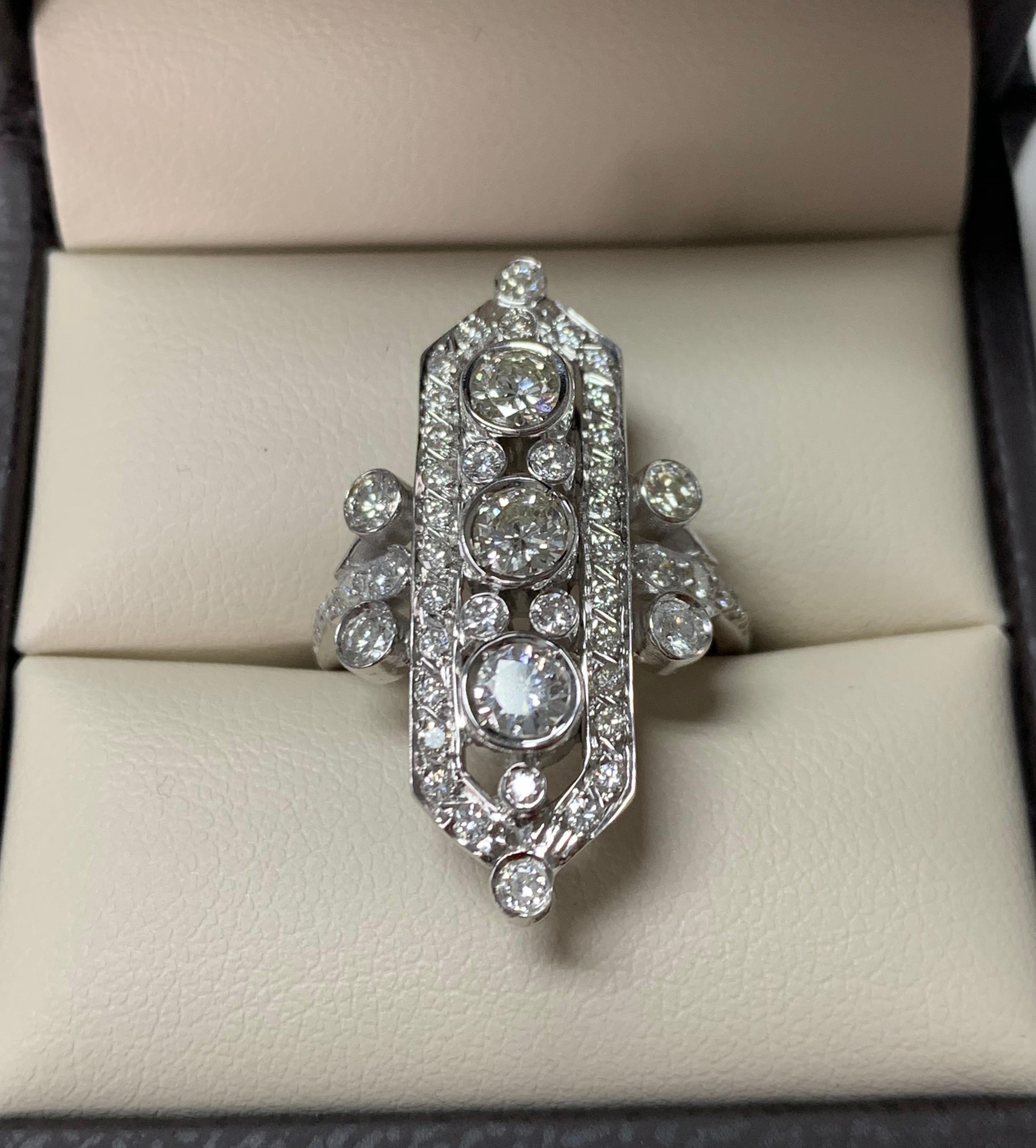 This classy three stone ring hand made in 14K white gold. 
The details are as follows : 
Diamond weight : 0.91 carat + 0.88 carat ( JK color and SI clarity ) 
Dimensions : 1 1/4 by 1 1/2 ( ring head ) 
Metal : 14 K white gold 
Ring size : 5 1/2 



