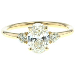 Three-Stone Oval Diamond Engagement Ring with Round Side Diamonds 'GIA'